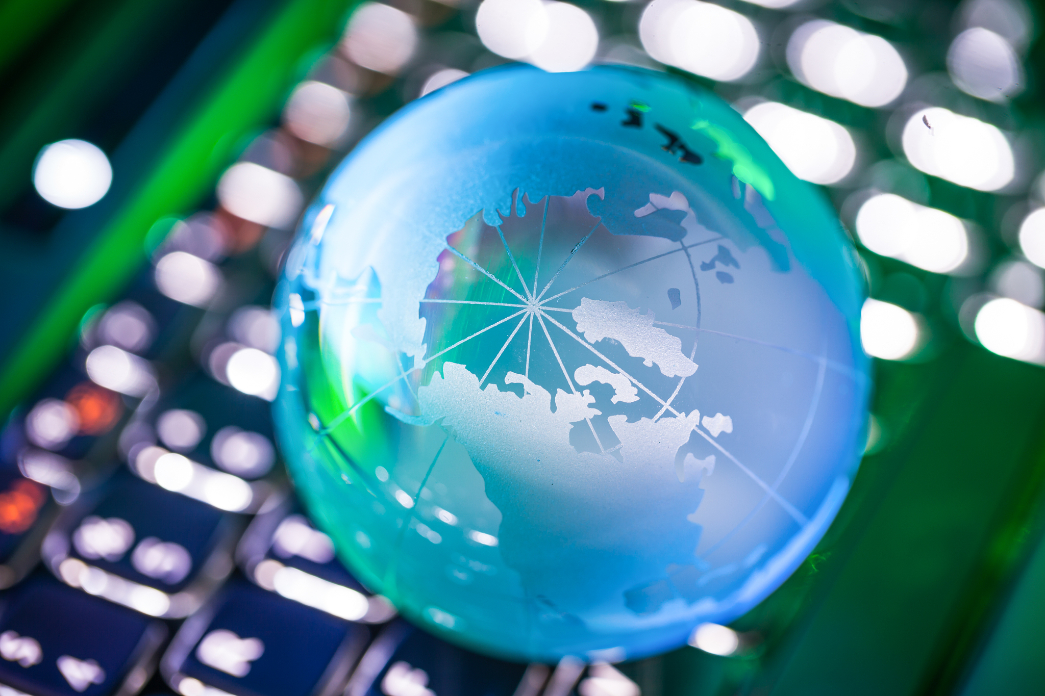 global crystal ball on keyboard