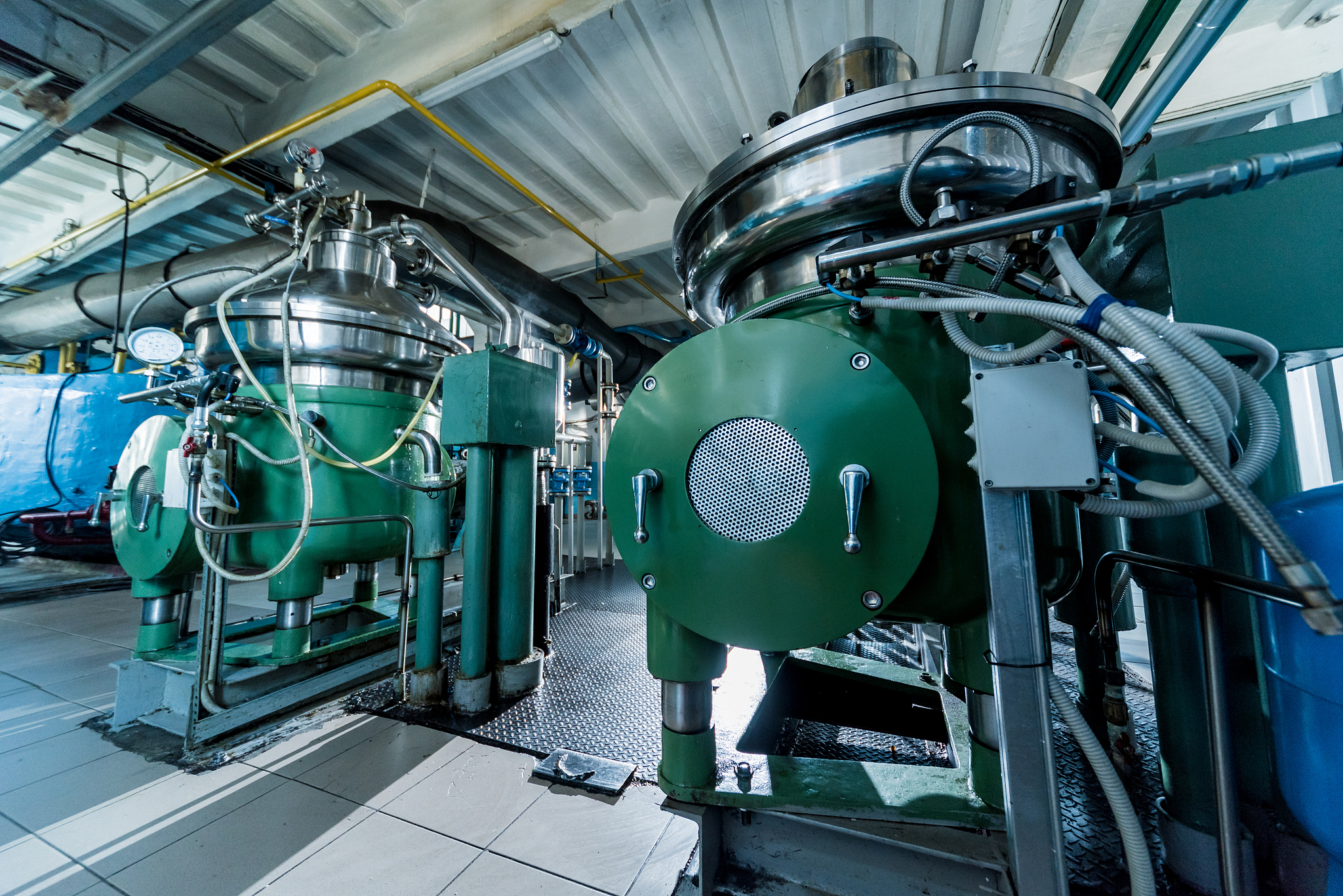 interior of modern natural oil factory. the piping, pumps and mo
