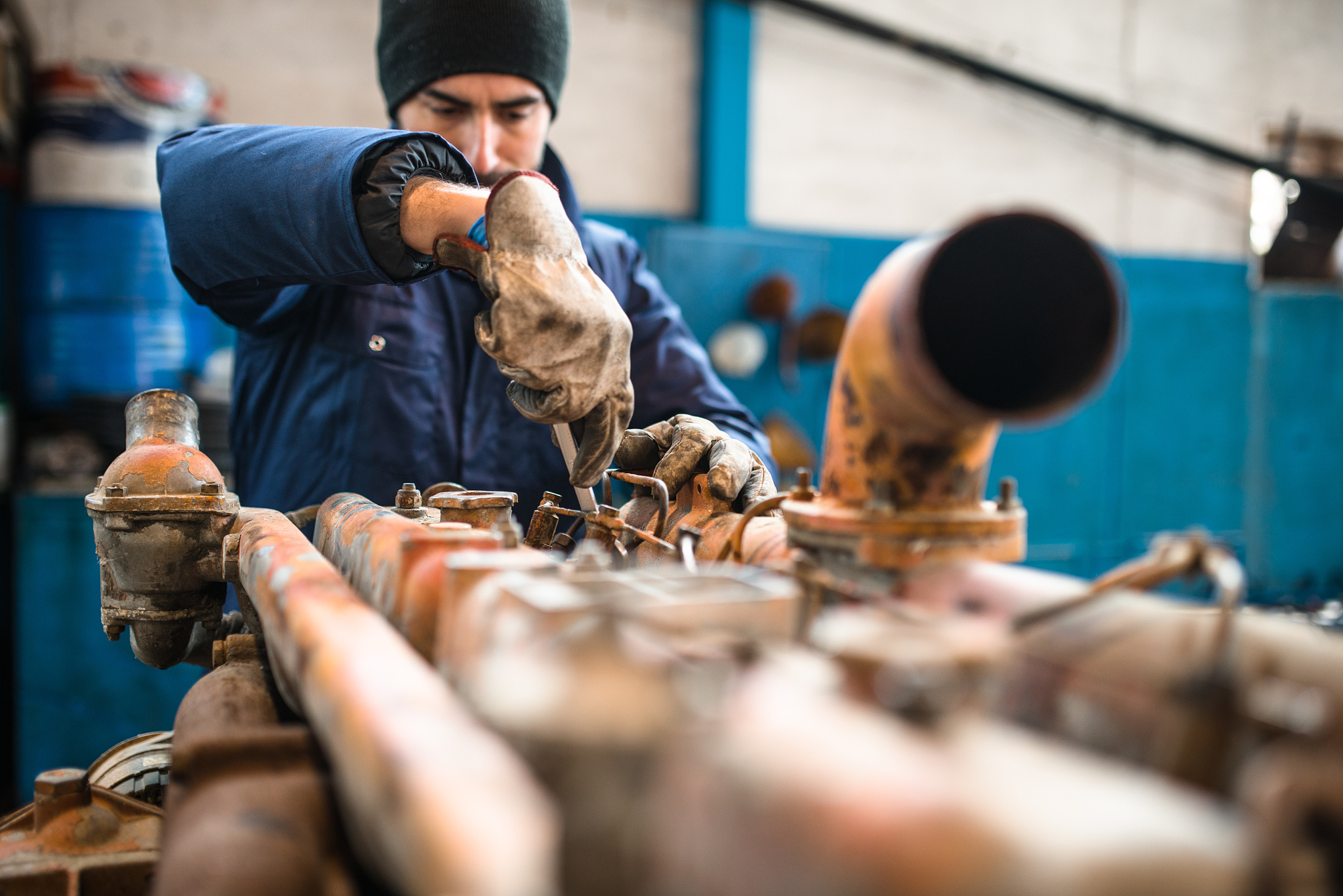 mechanic working in a workshop on a truck engine