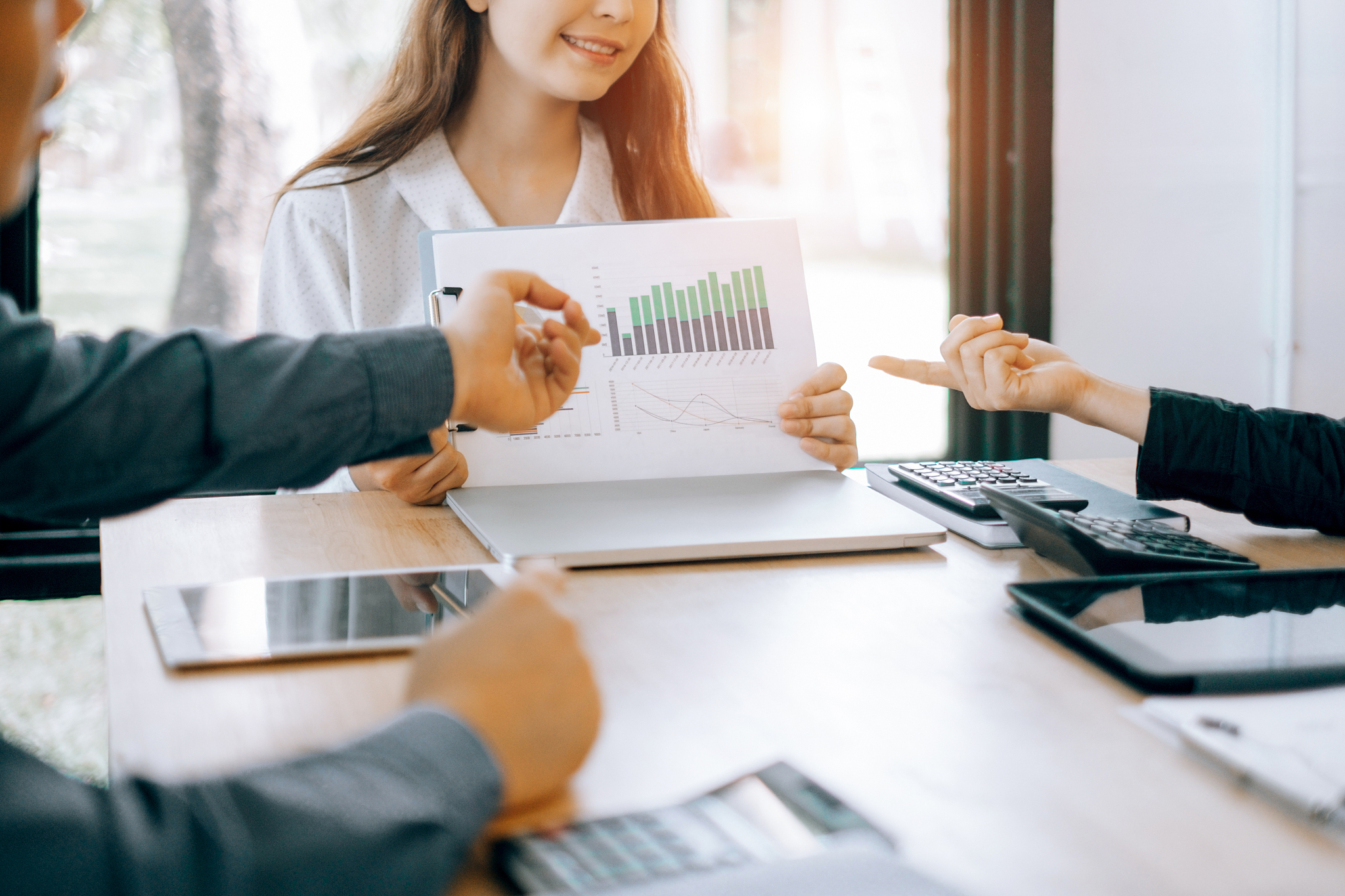 business people analyzing investment graph meeting brainstorming