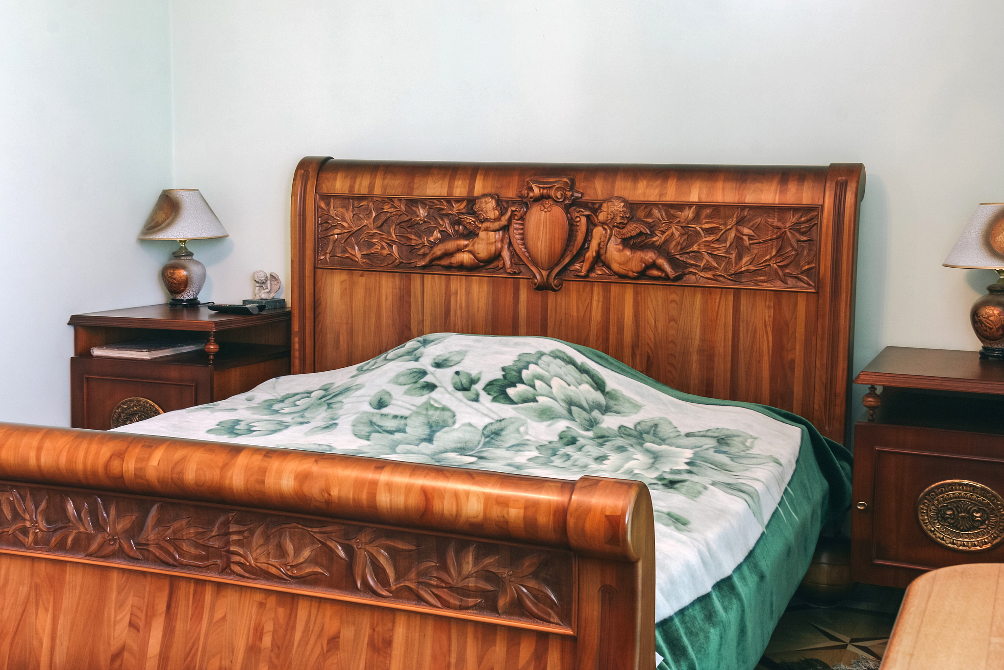 wood bed with carved headboard
