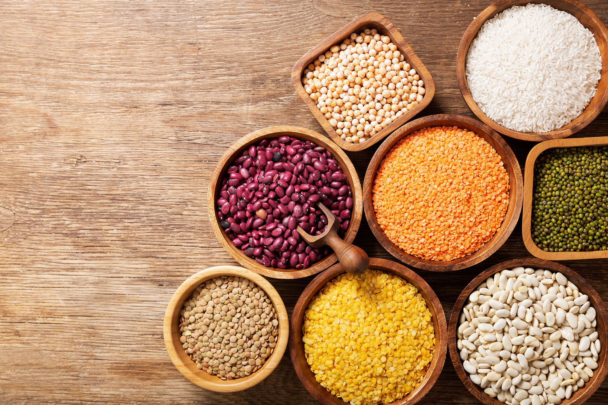 bowls of legumes, lentils, chickpeas, rice and beans, top view