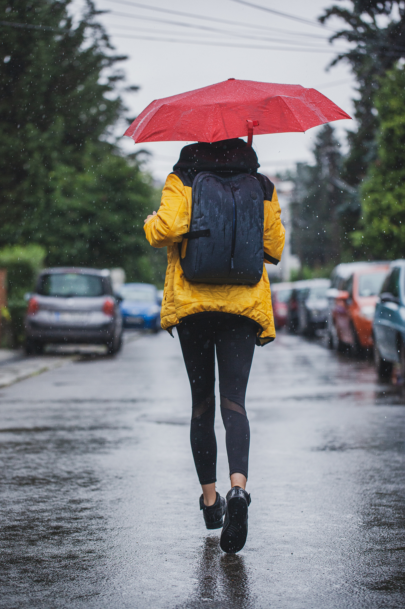 beautiful woman on the street while raining
