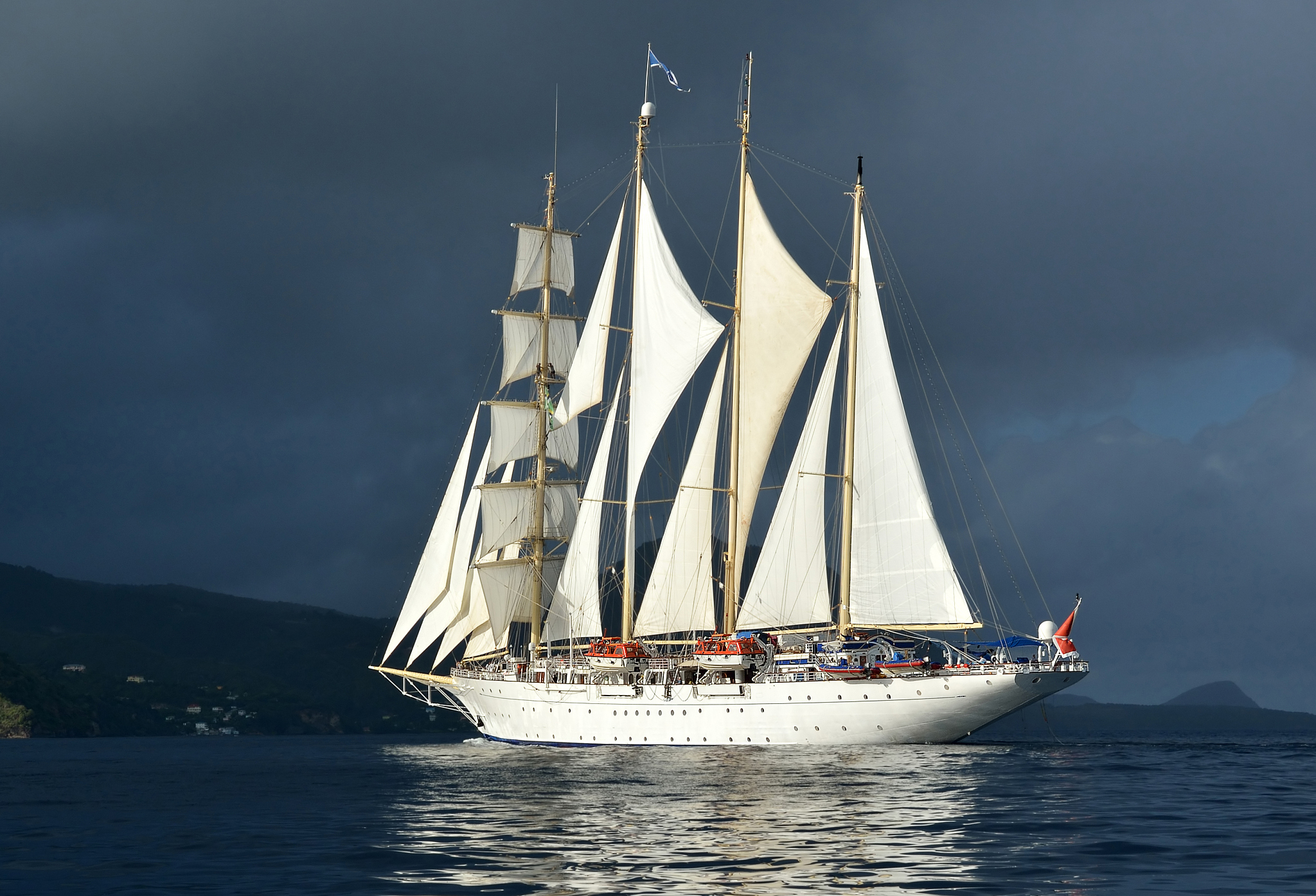 sailing. sailing ship under white sails and storm sky. yachting.