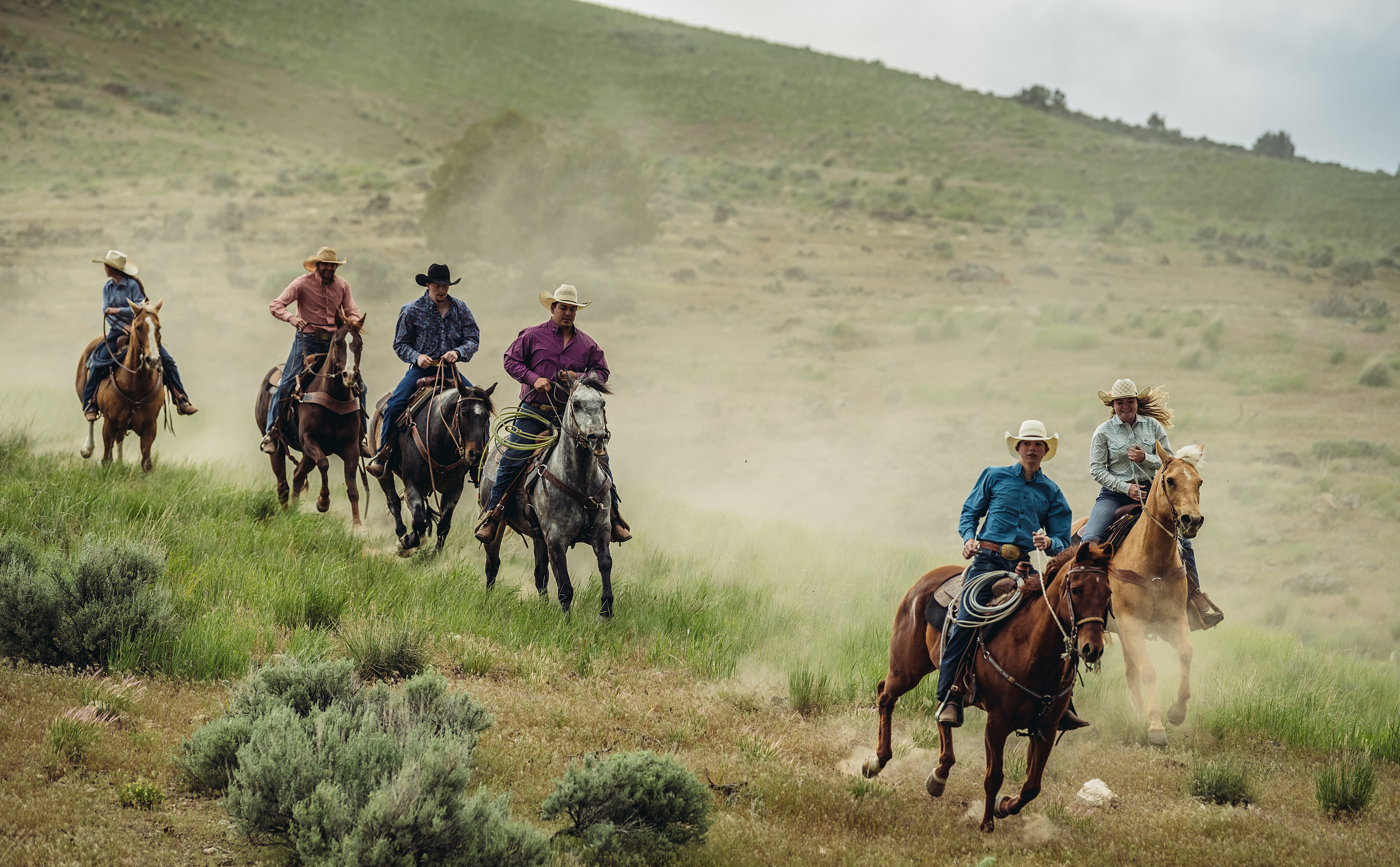 utah ranchers galloping on horses