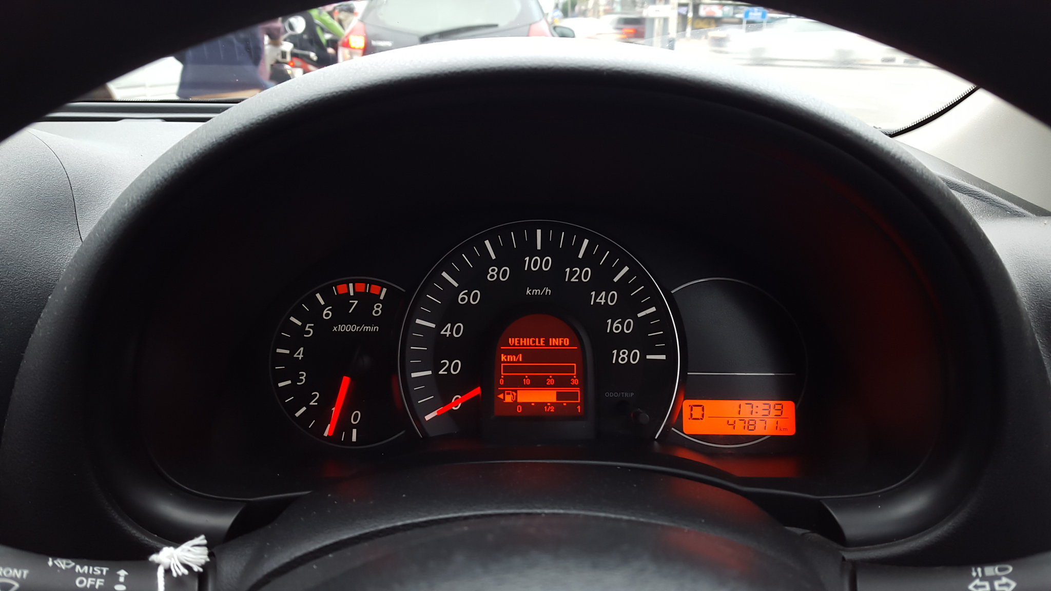 car driving at day,show instrument panel and traffic jam.