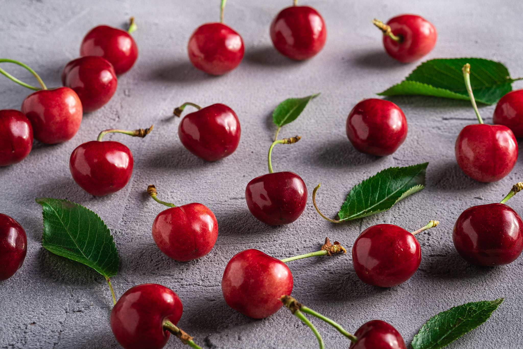 fresh ripe cherry fruits with green leaves, summer vitamin berri