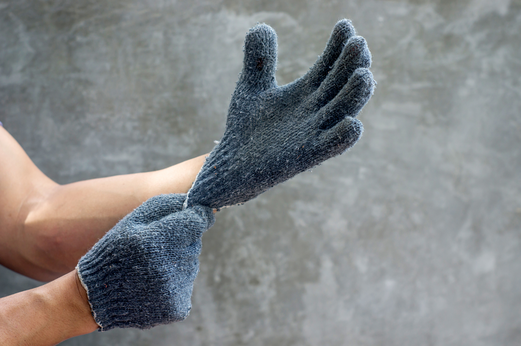 man wearing a gray glove.