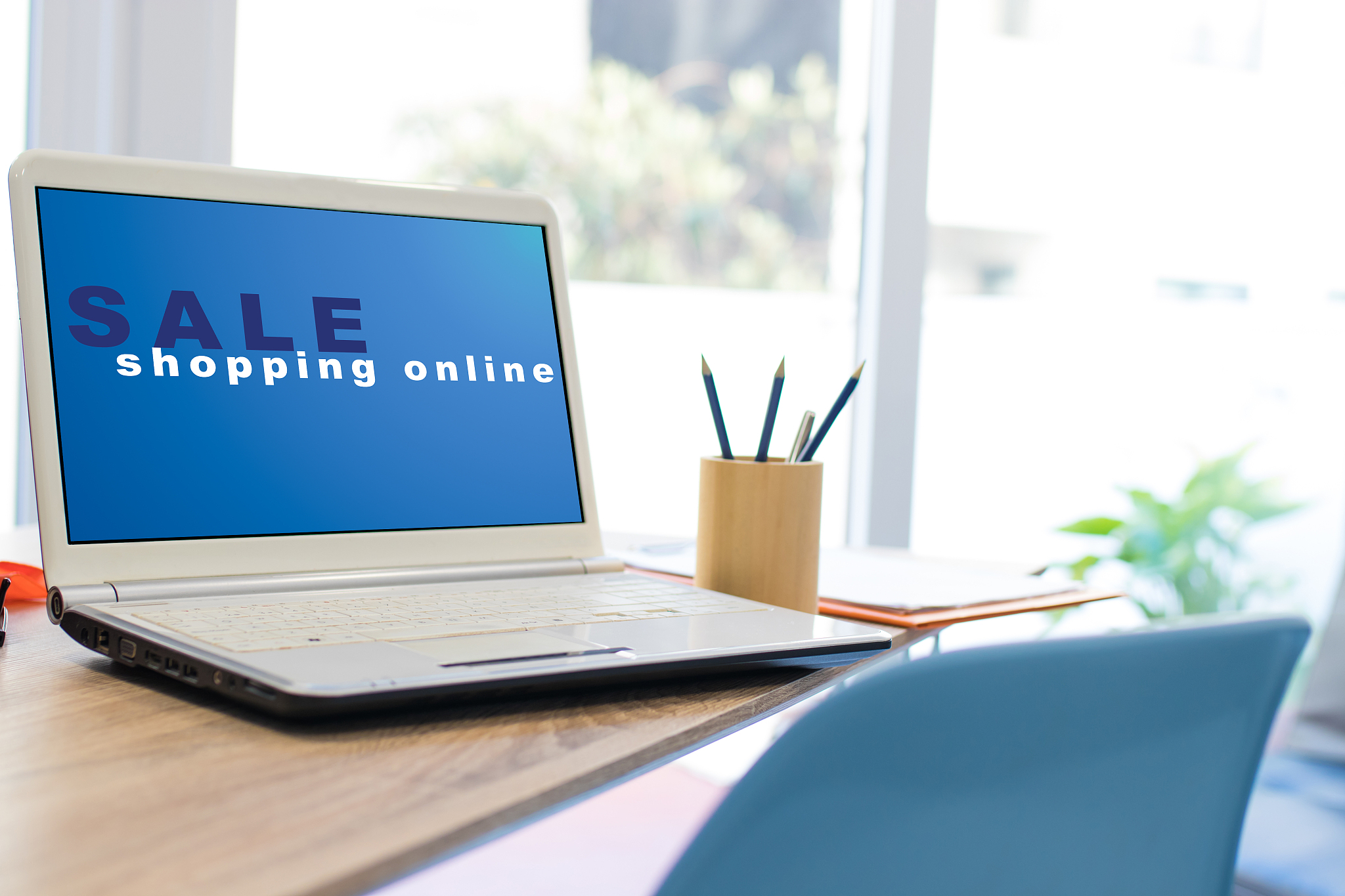 desktop with laptop and online shopping web