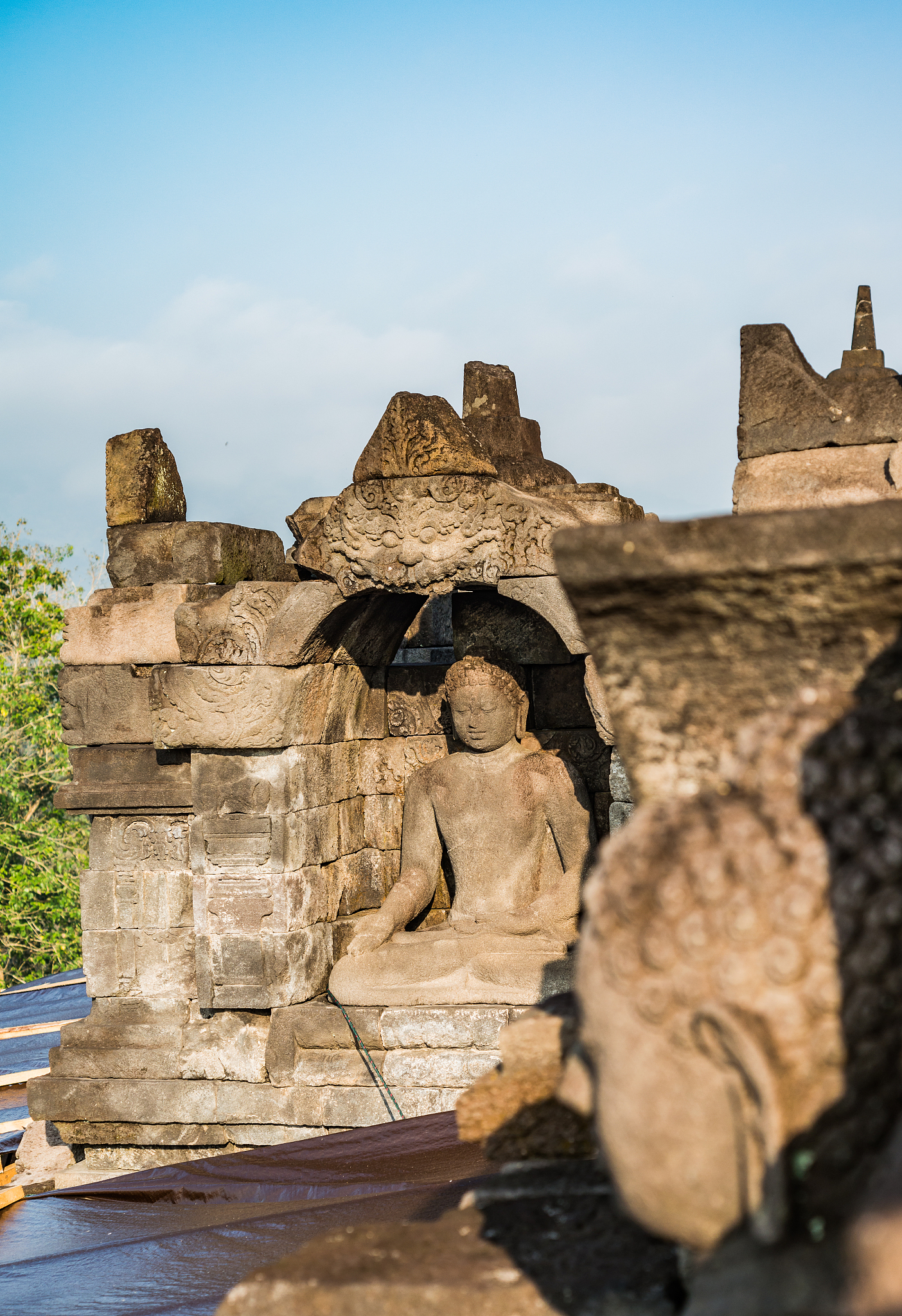 buddha statue in borobudur temple, java island, indonesia.