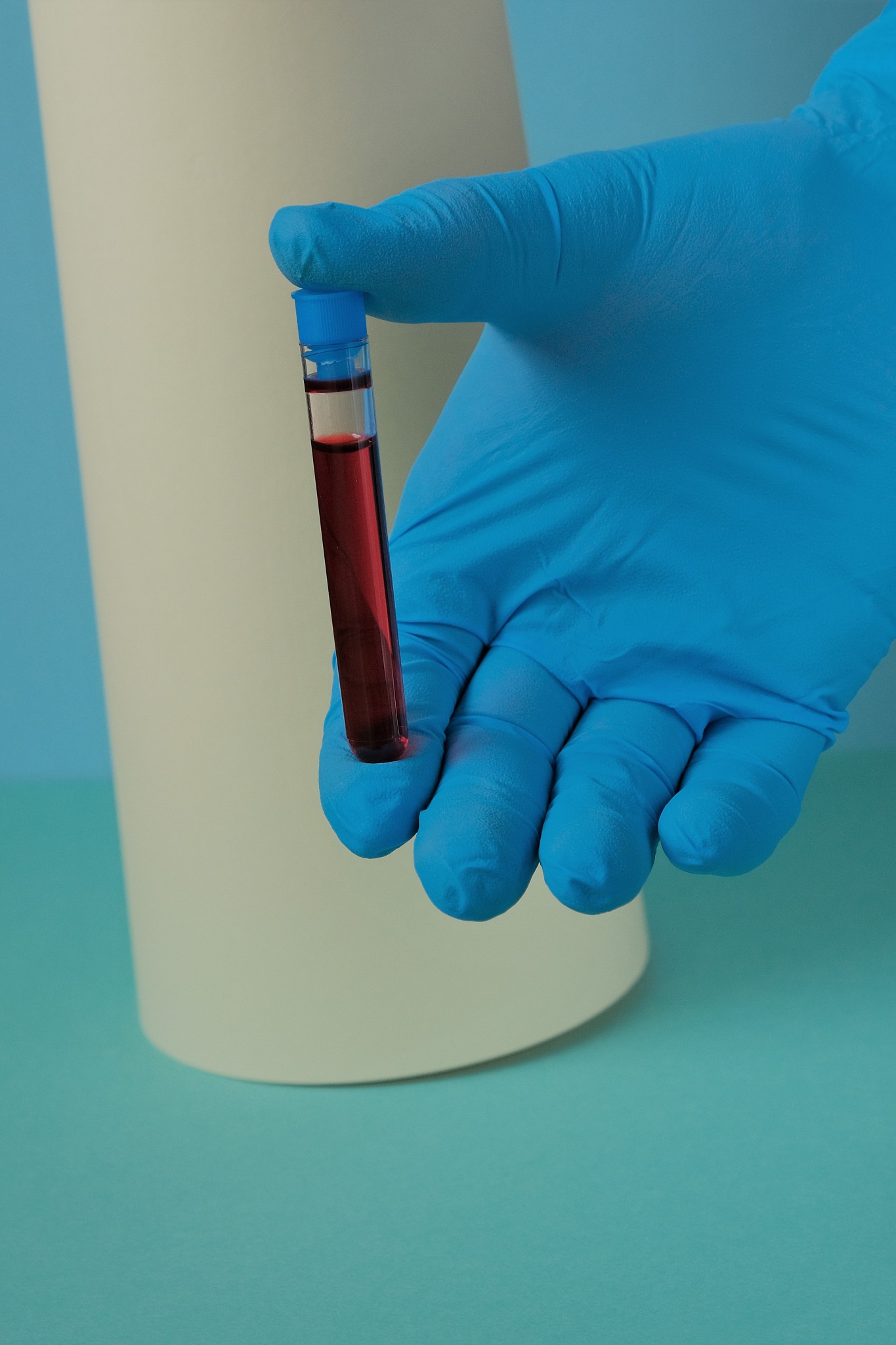 blood test for viruses. medicine and health.hand in blue glove a