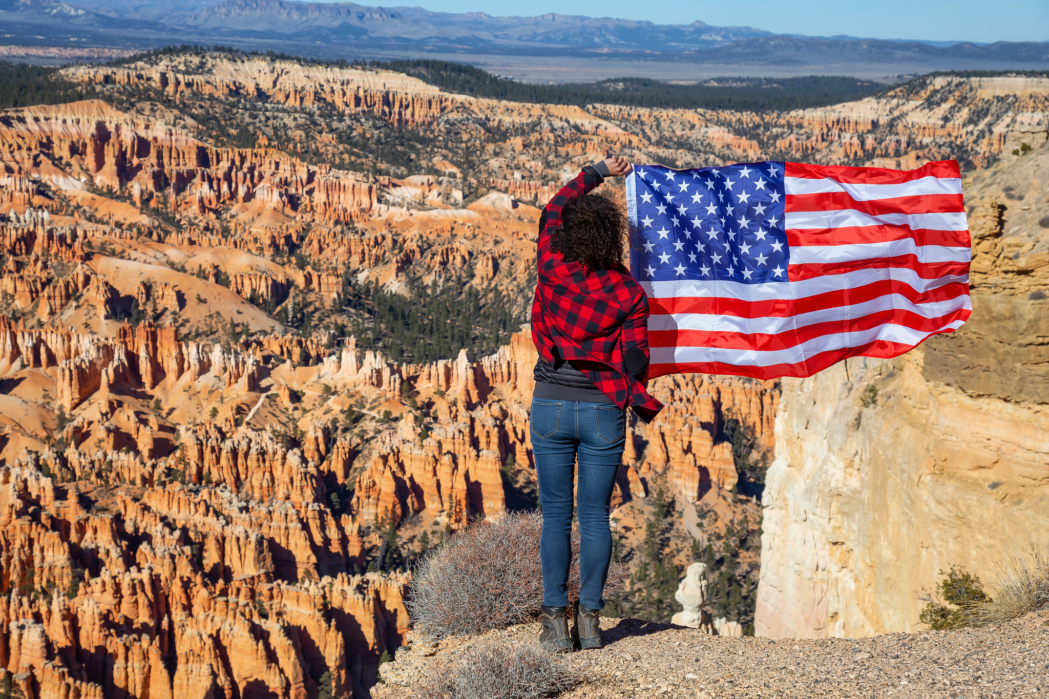 girl holding american flag