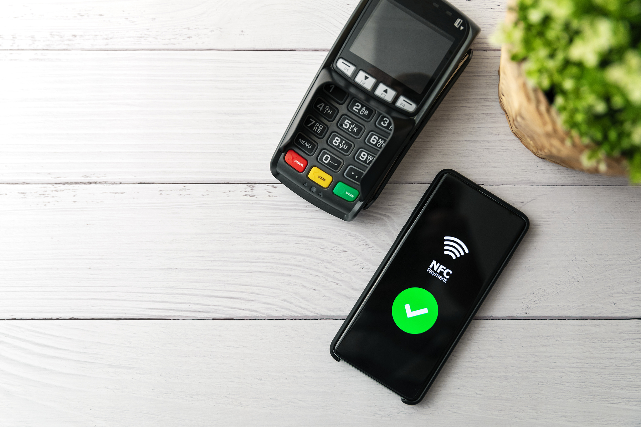 nfc contactless payment with phone. copy space top view