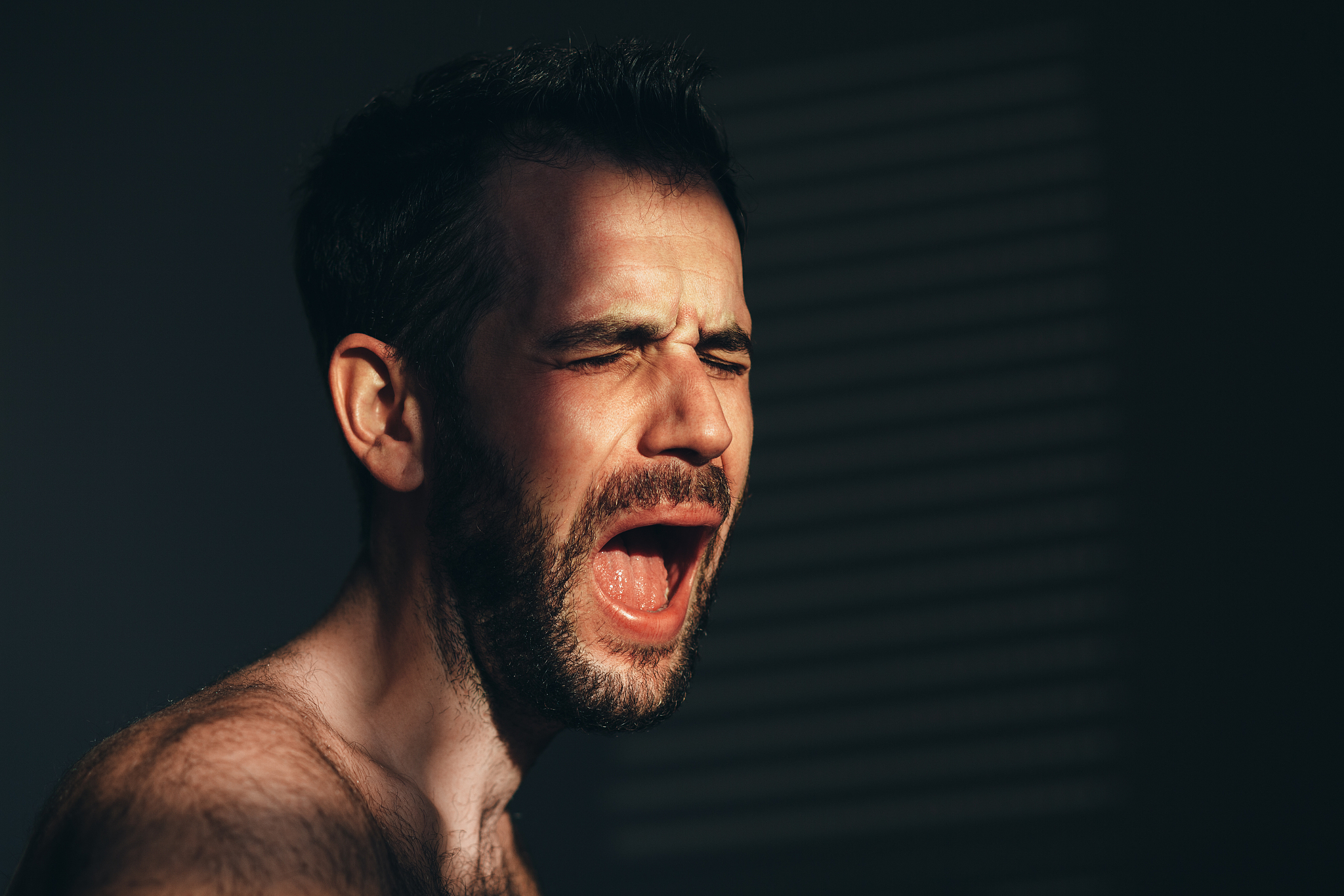 young man screaming and crying