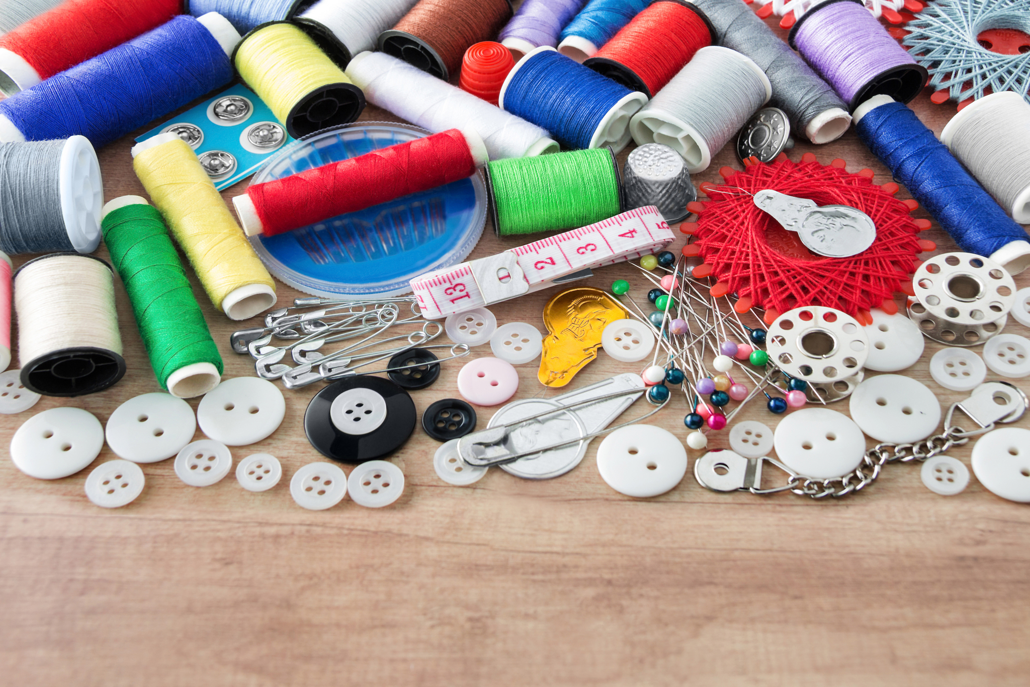 sewing kit and sewing thread as one background