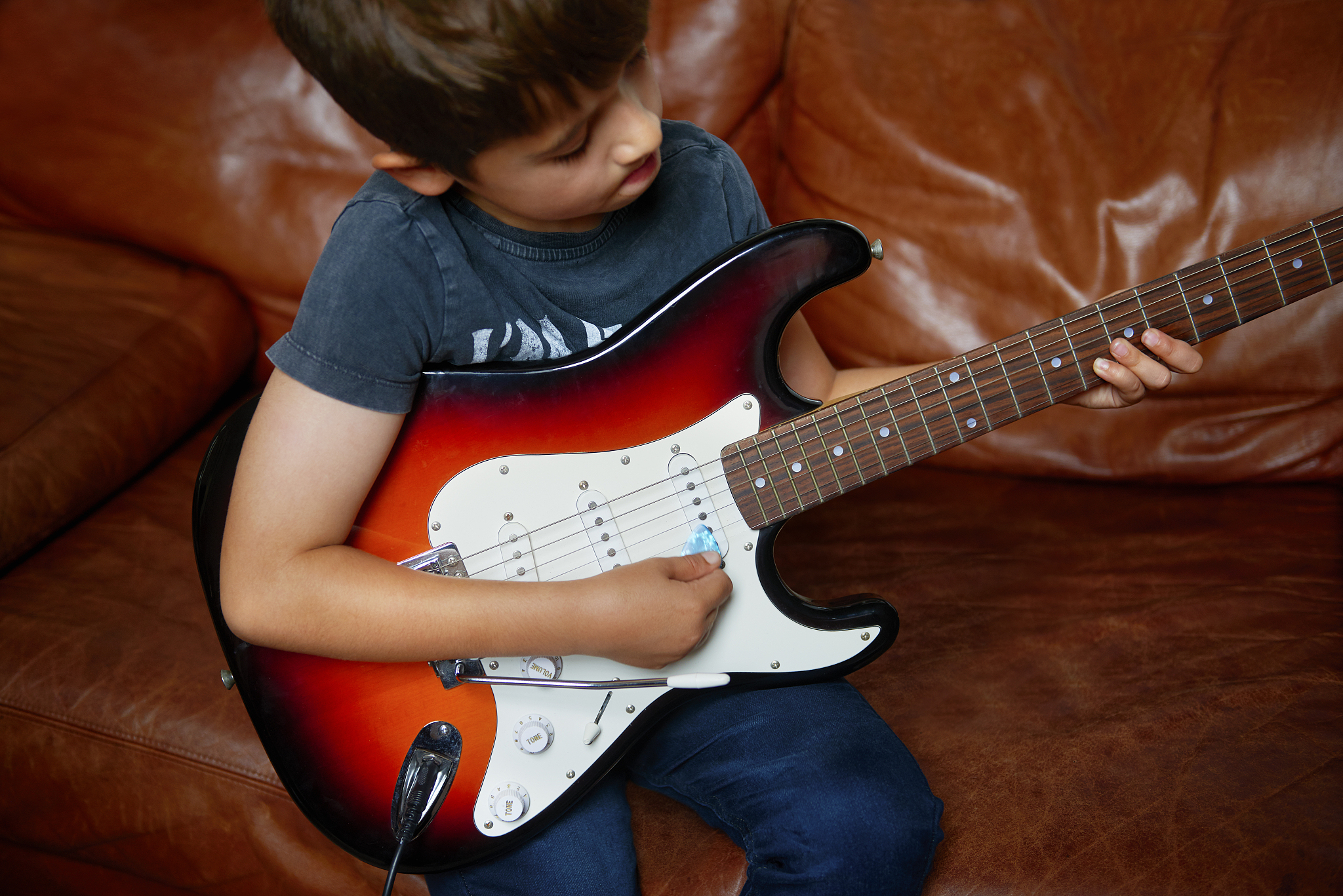 child prodigy playing electric guitar