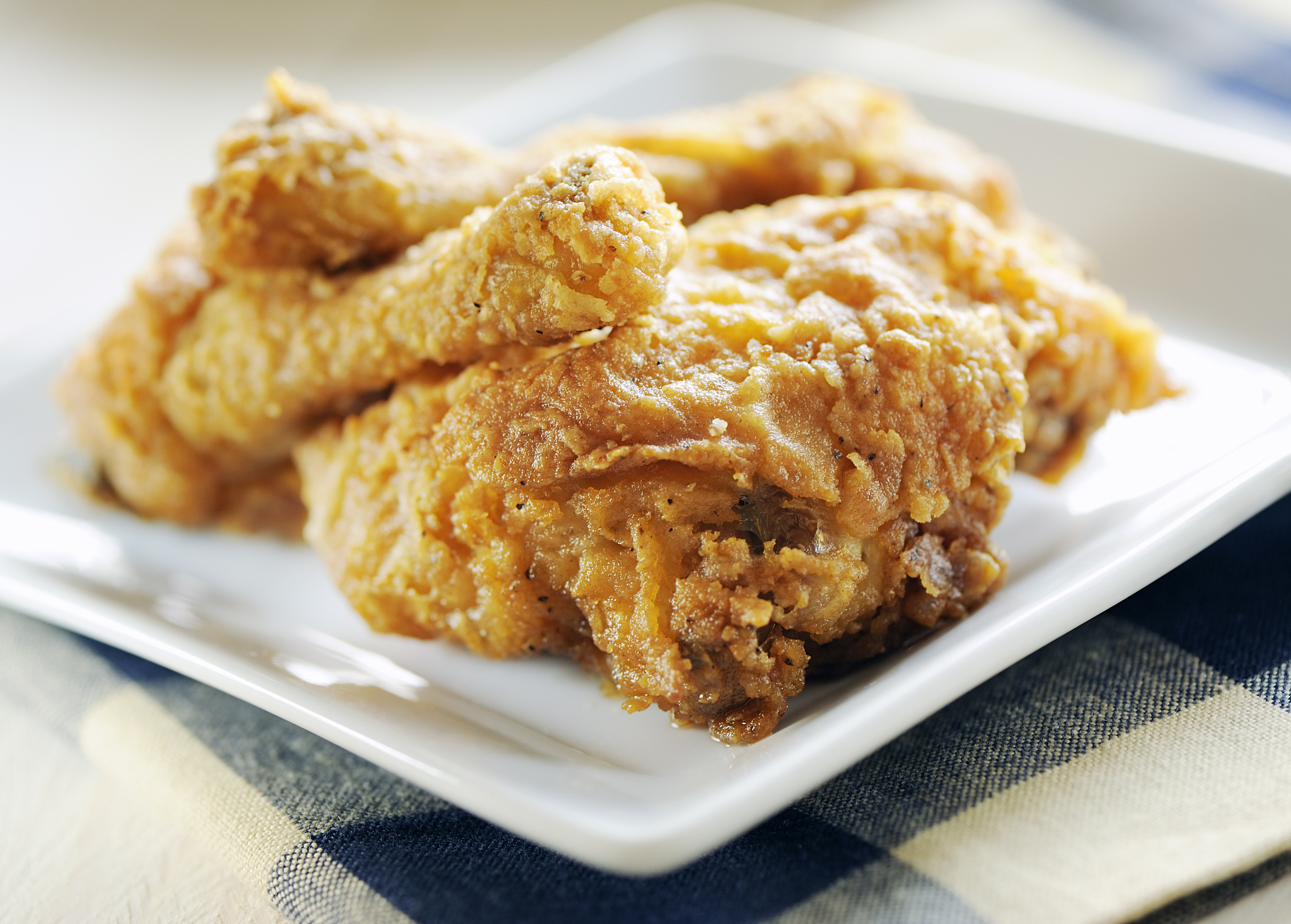 a square plate of fried chicken