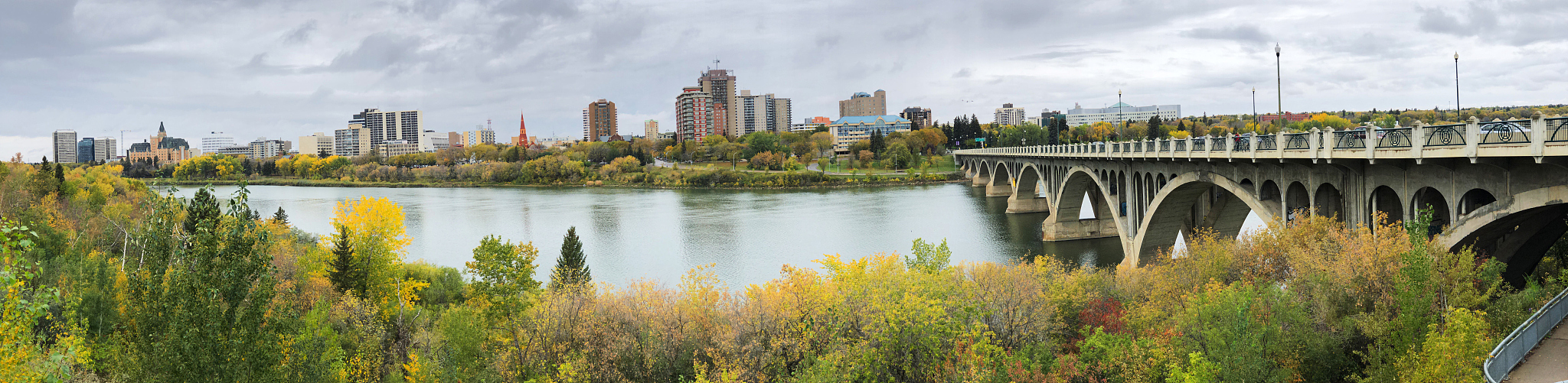 panorama of saskatoon, canada skyline over river