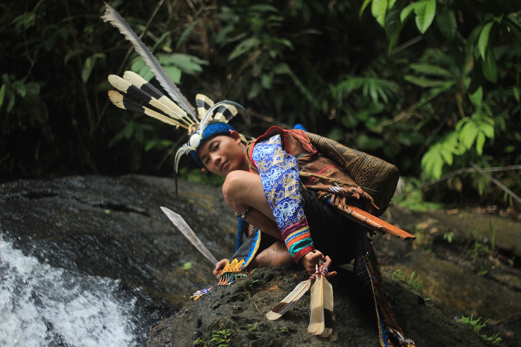 low angle portrait of young man wearing traditional clothing cro
