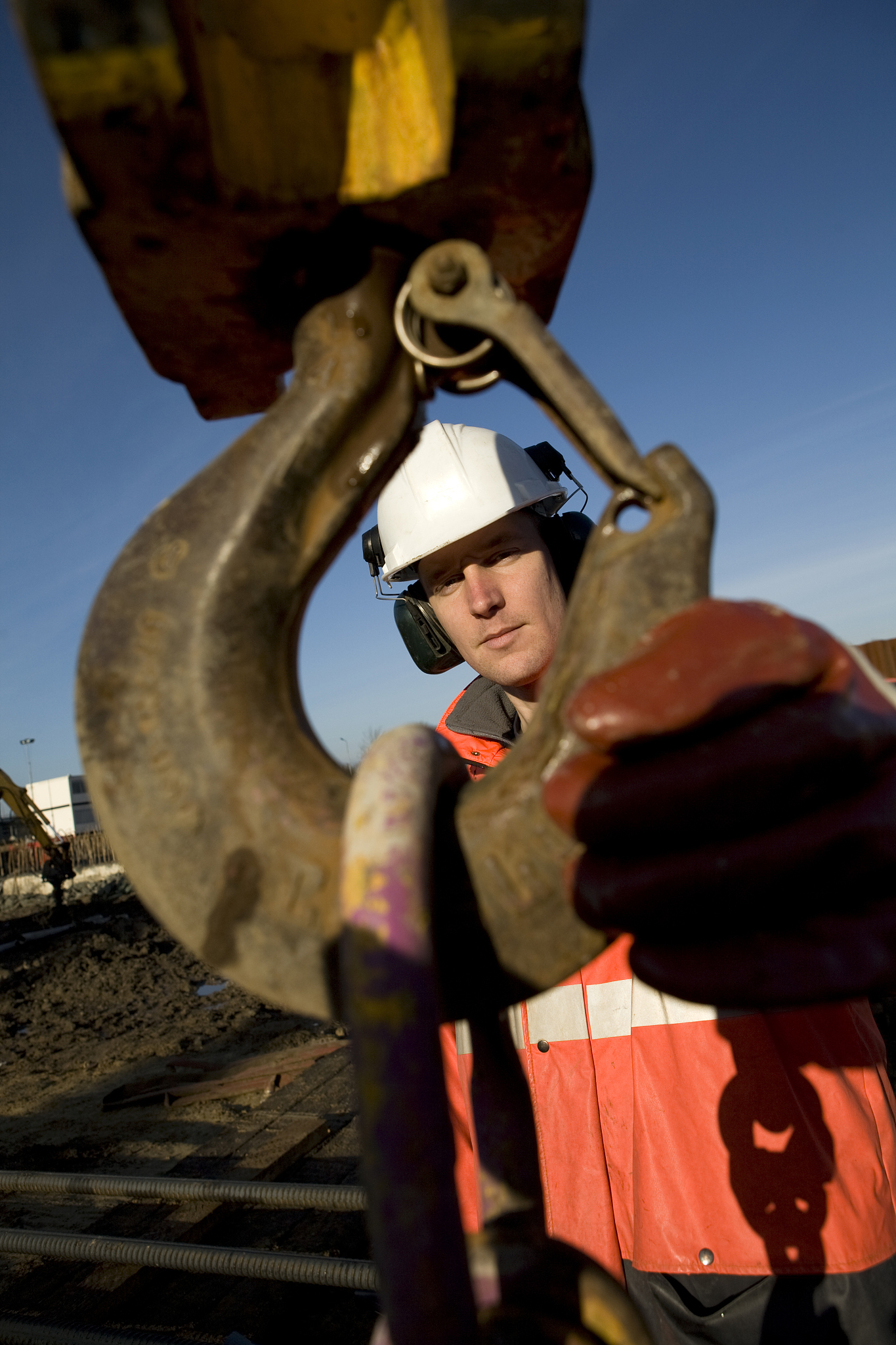 young construction worker at building pit