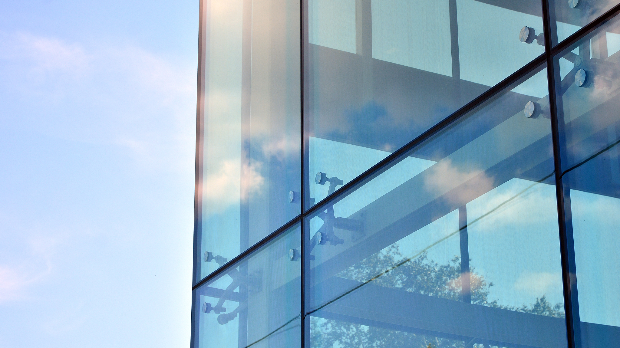 facade texture of a glass mirrored office building.