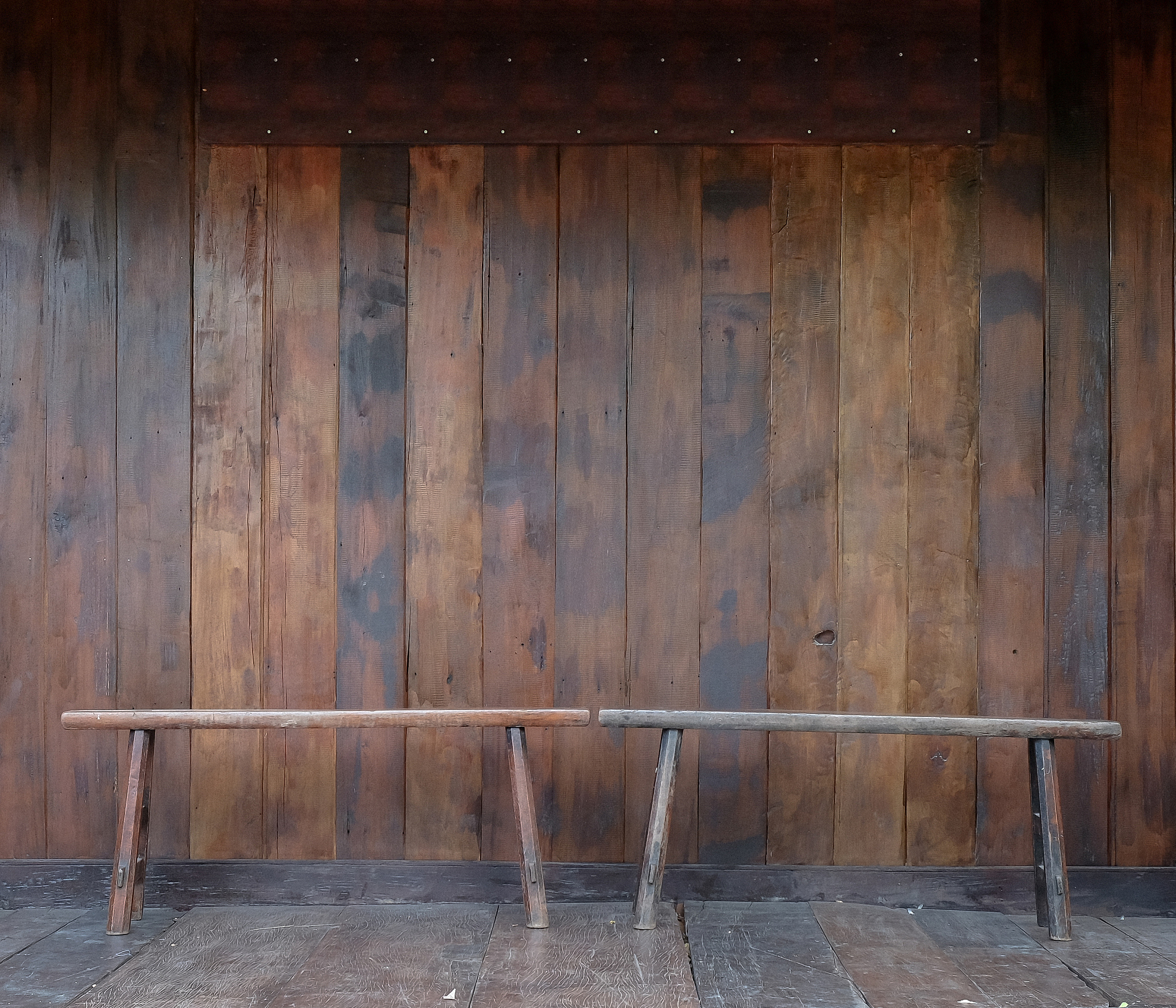 wooden bench in a room with old wood