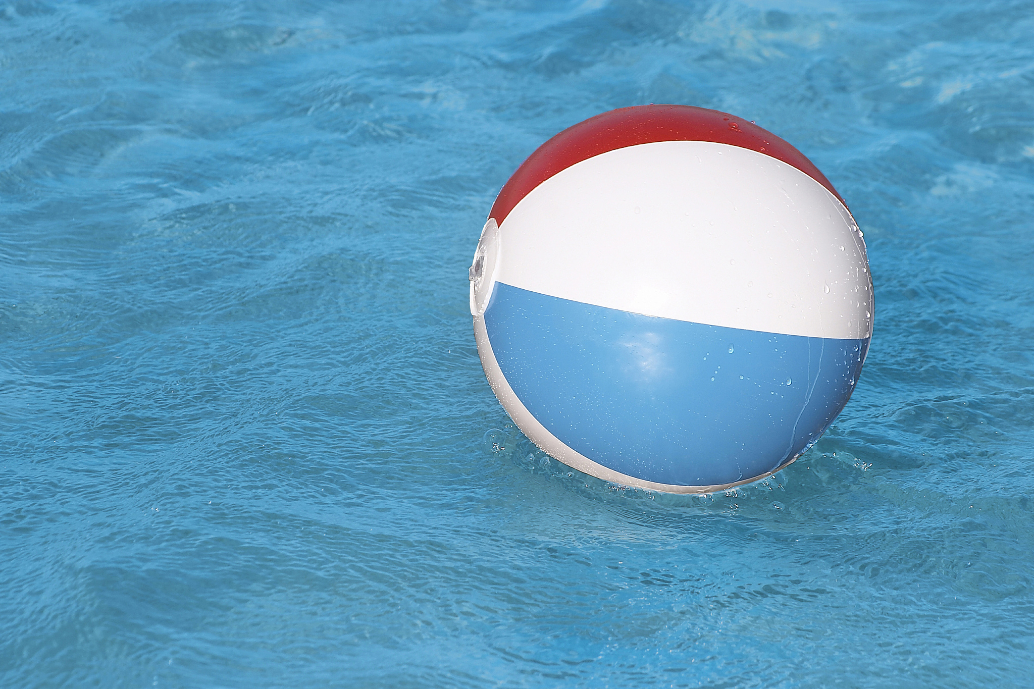 beach ball floating on ocean