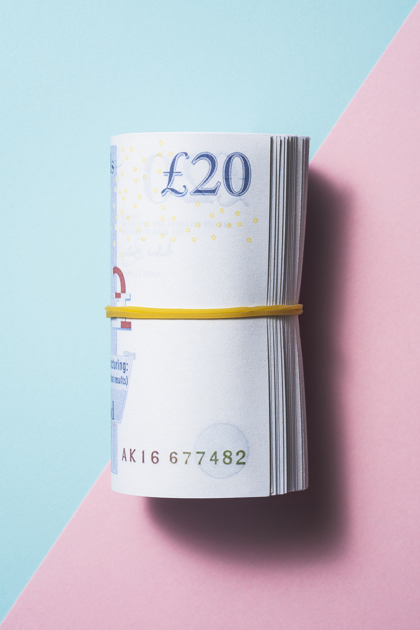british pound roll on two tone color background