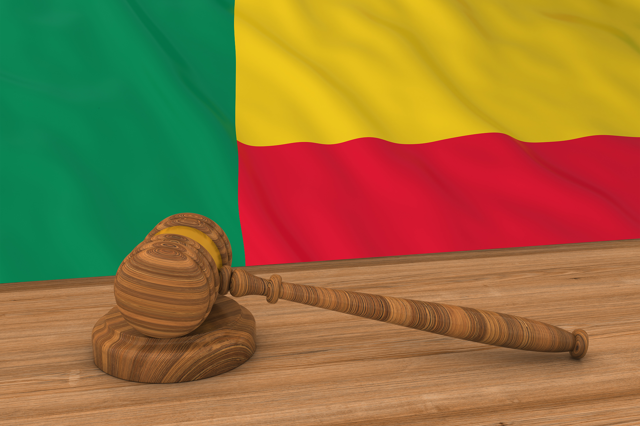beninese law concept - flag of benin behind judge's gavel 3d ill