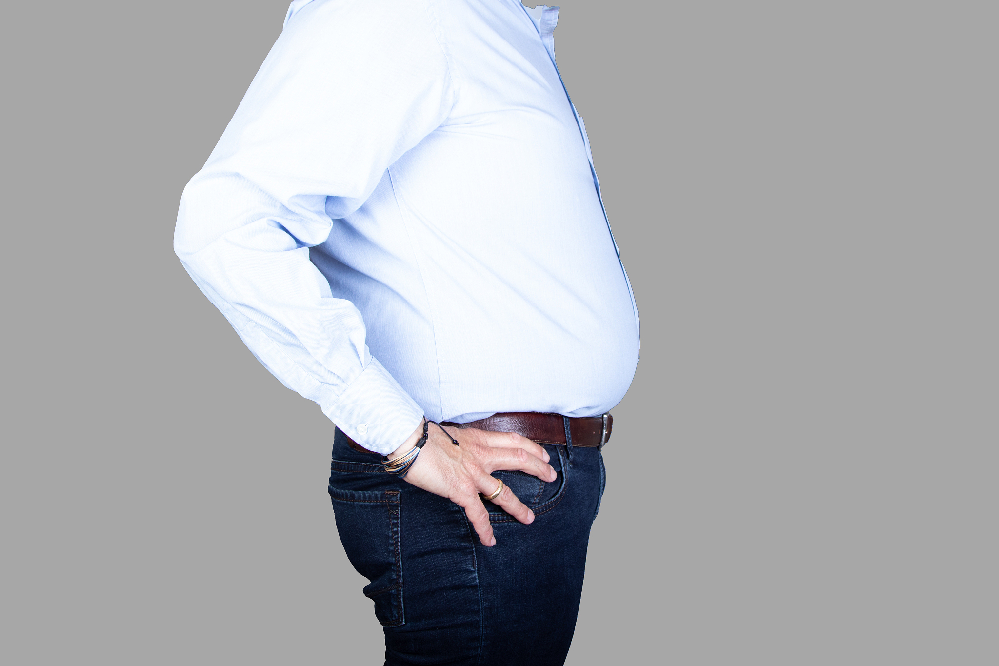 man with a big belly wearing a shirt and jeans