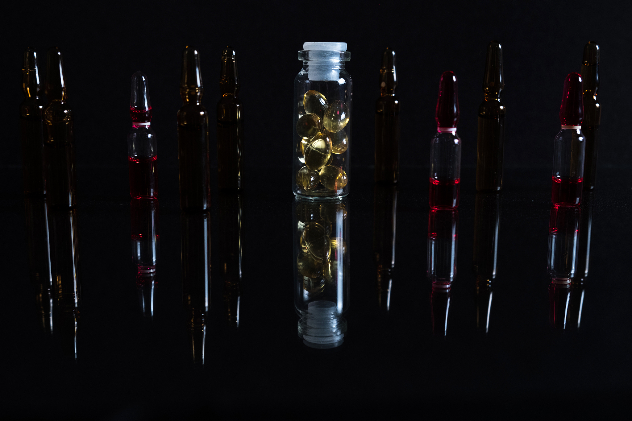 pill bottle and pills in isolated on black concept pharmacy