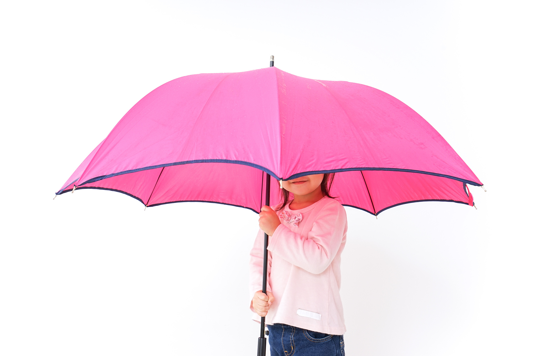 a child opening an umbrella