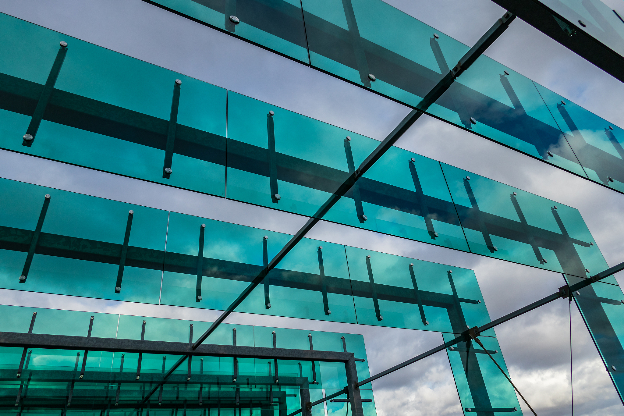 the glass architecture in city against a sky