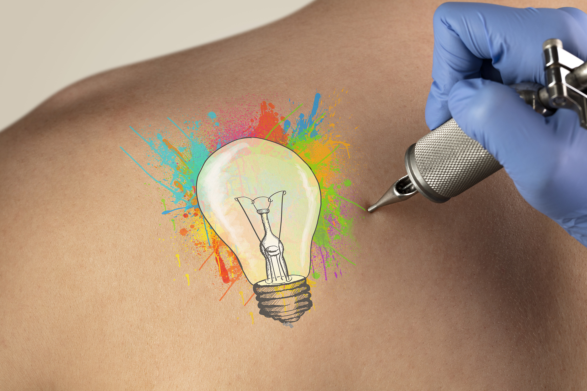 tattooing idea concept on naked back