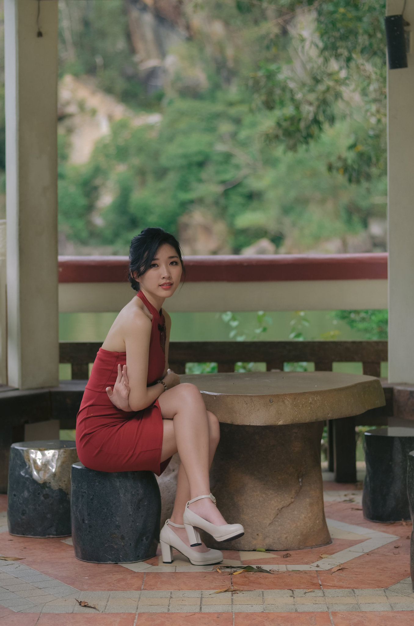 a young and attractive chinese woman wear red cheongsam with dif