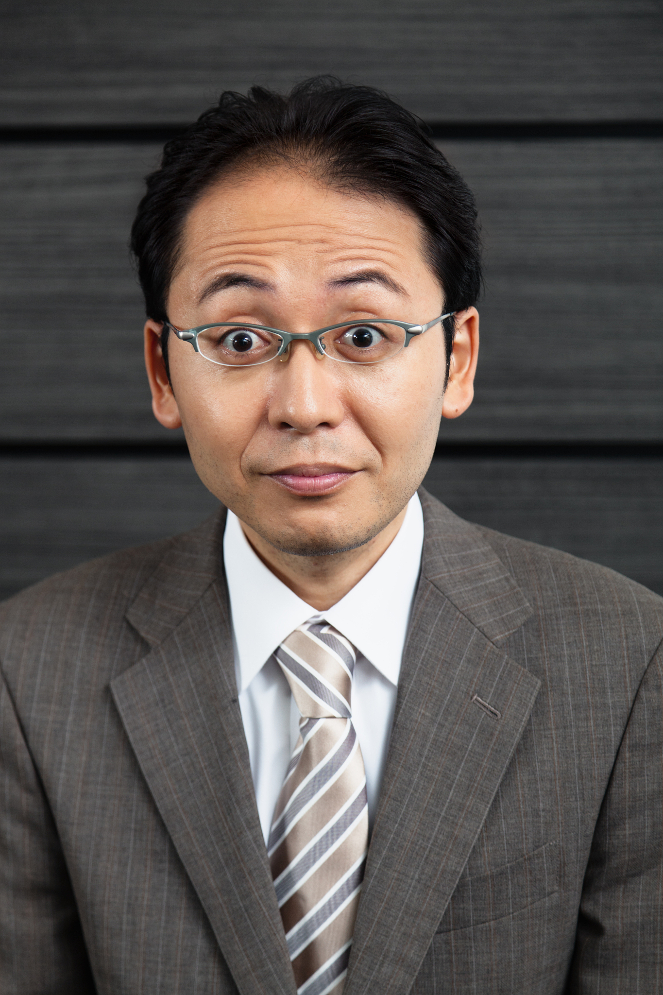 japanese businessman looking surprised.
