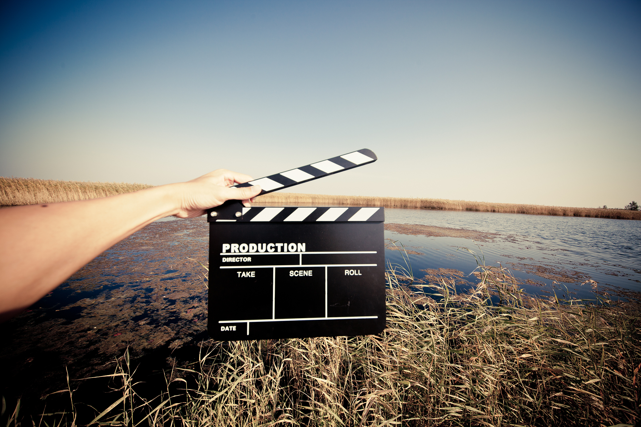 hands holding a movie clapboard