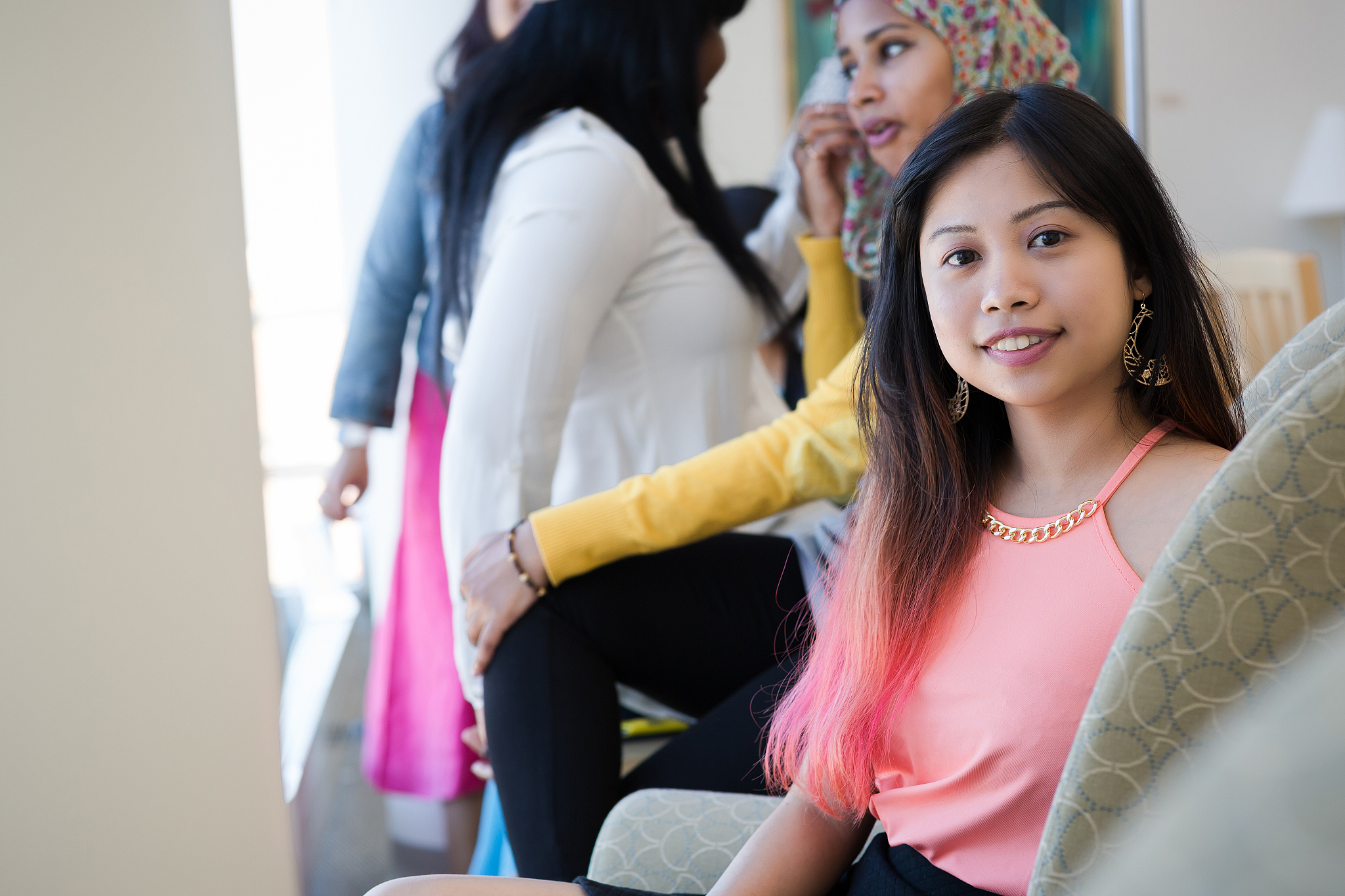 female students hanging out in the library