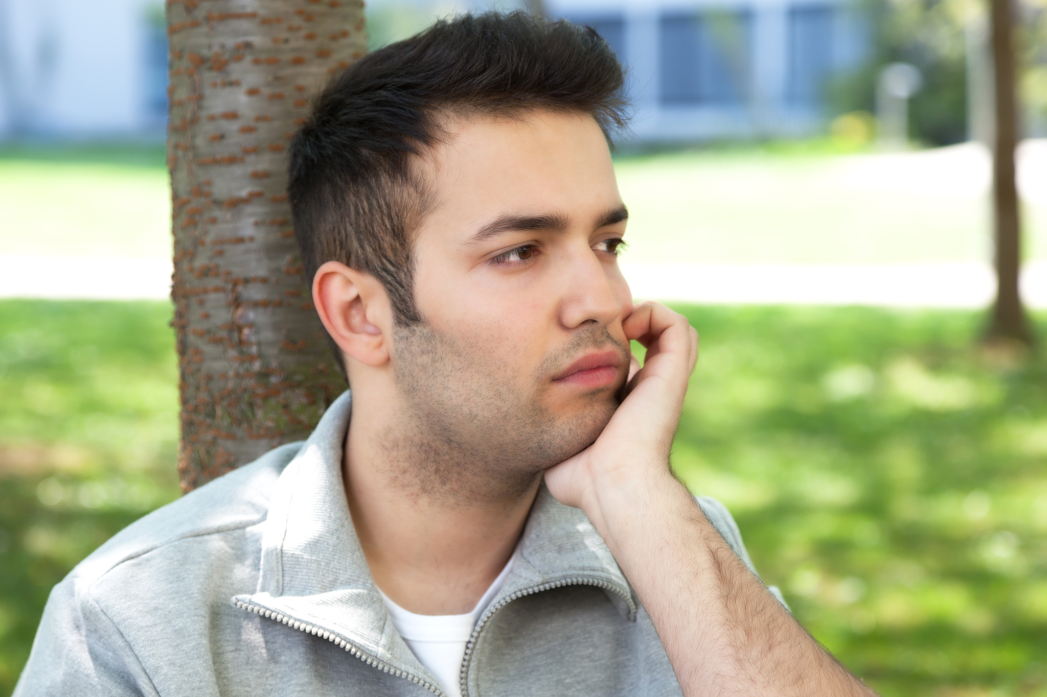 young student in a park with depression