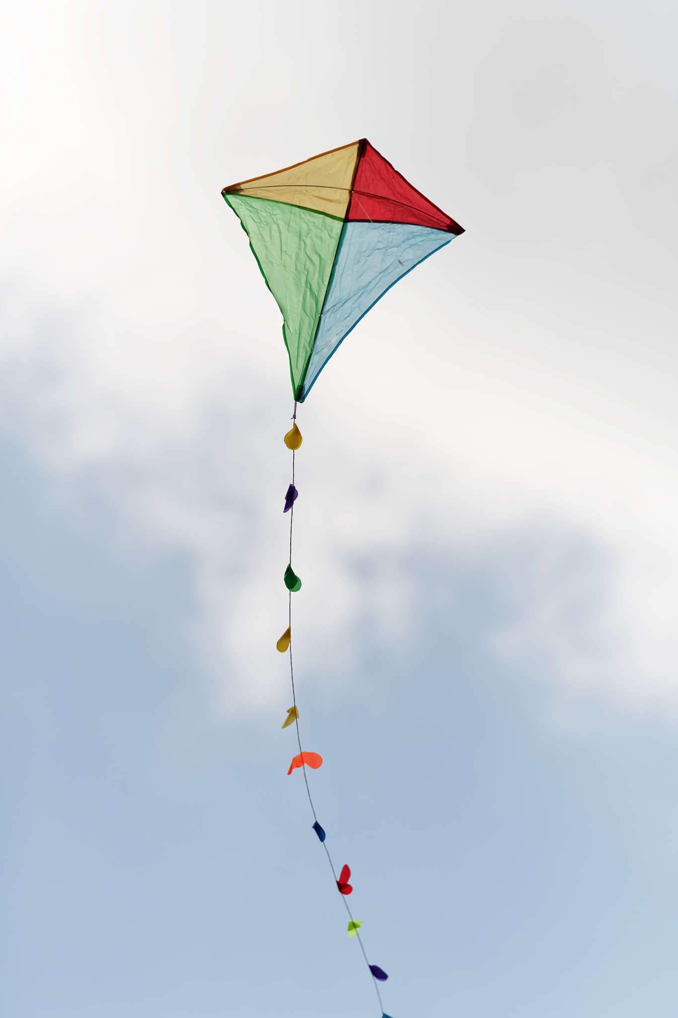 colorful kite in a cloudy sky