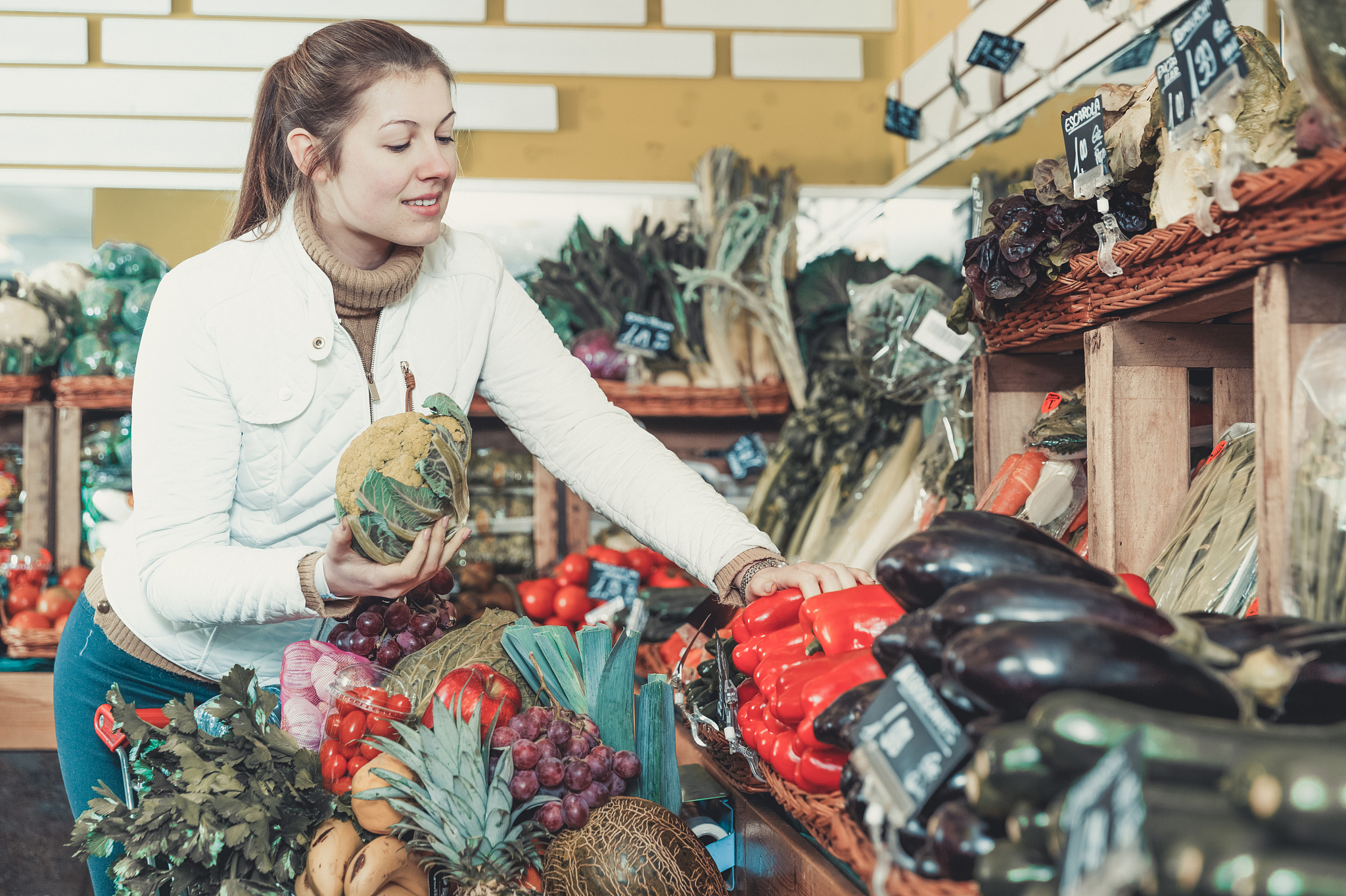 young woman in greengrocery