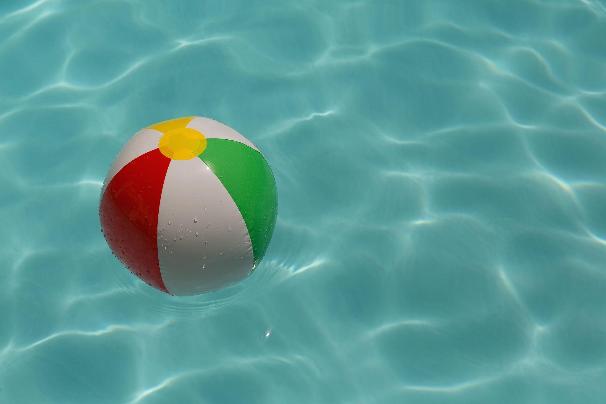 inflatable ball floating in swimming pool