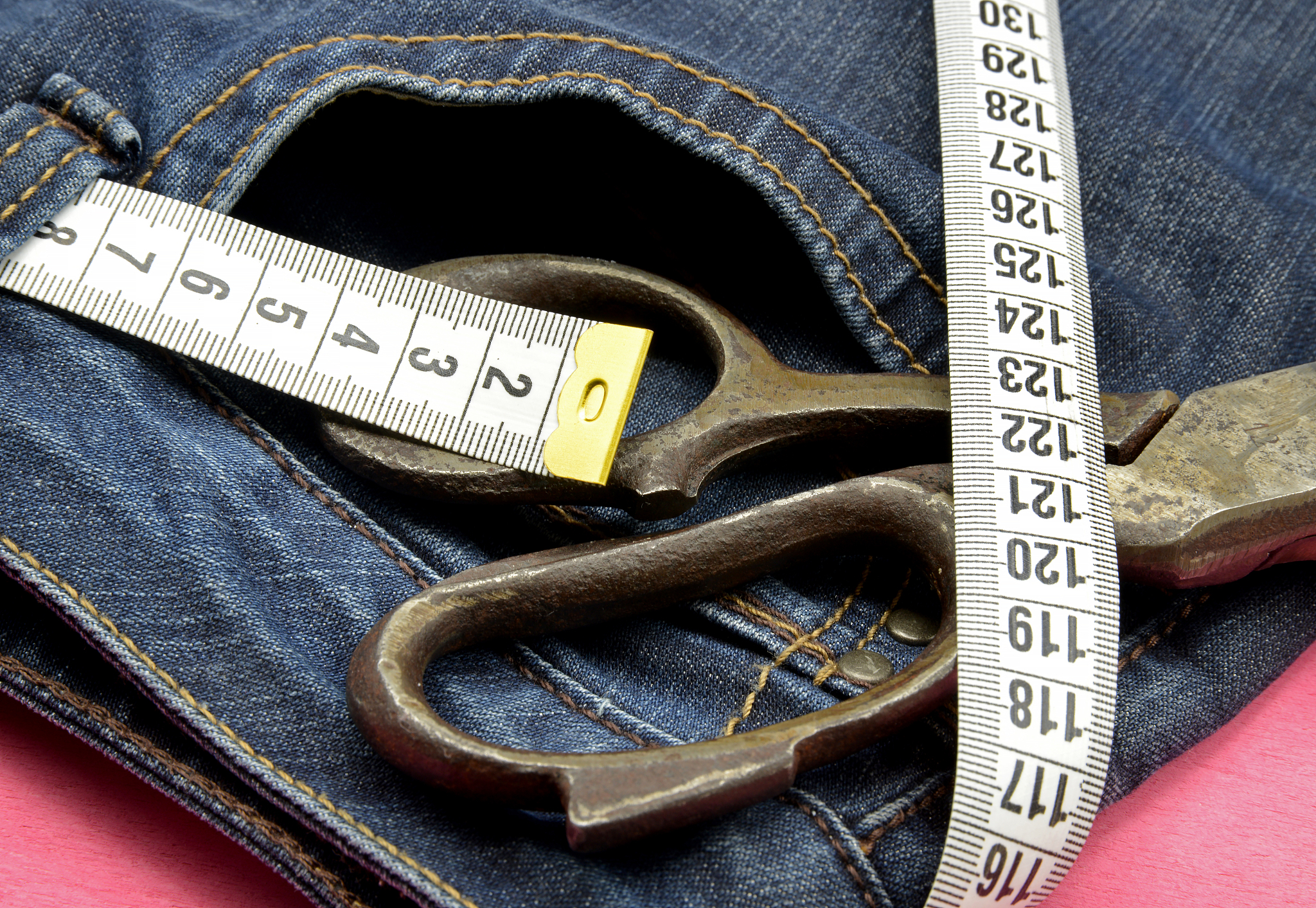 measuring tape on blue  jeans