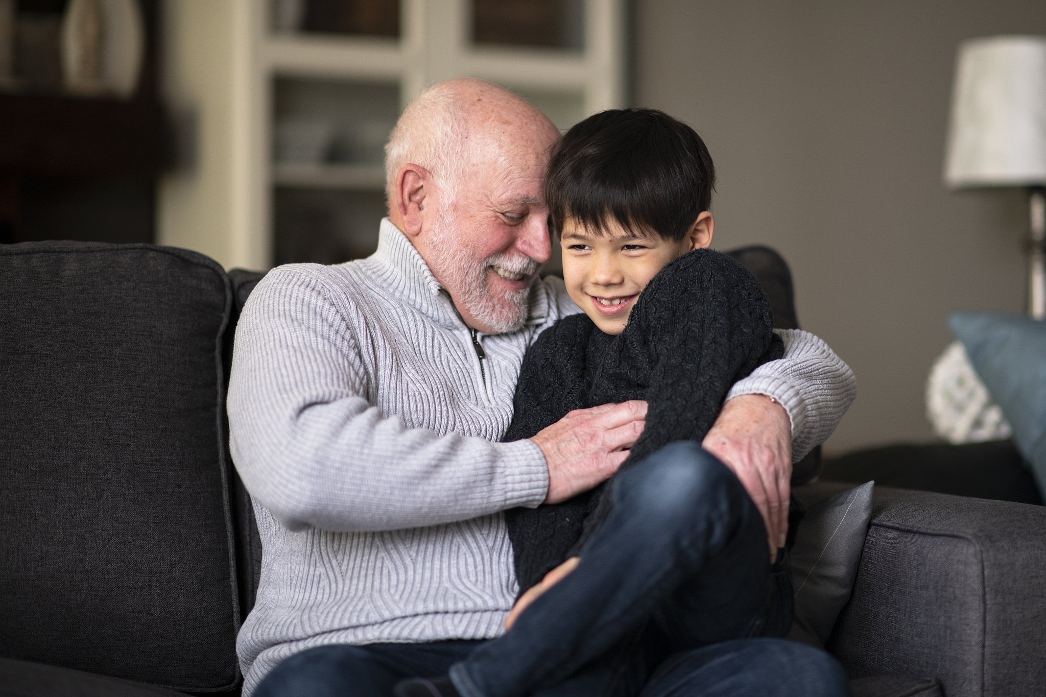 grandfather and grandson snuggling