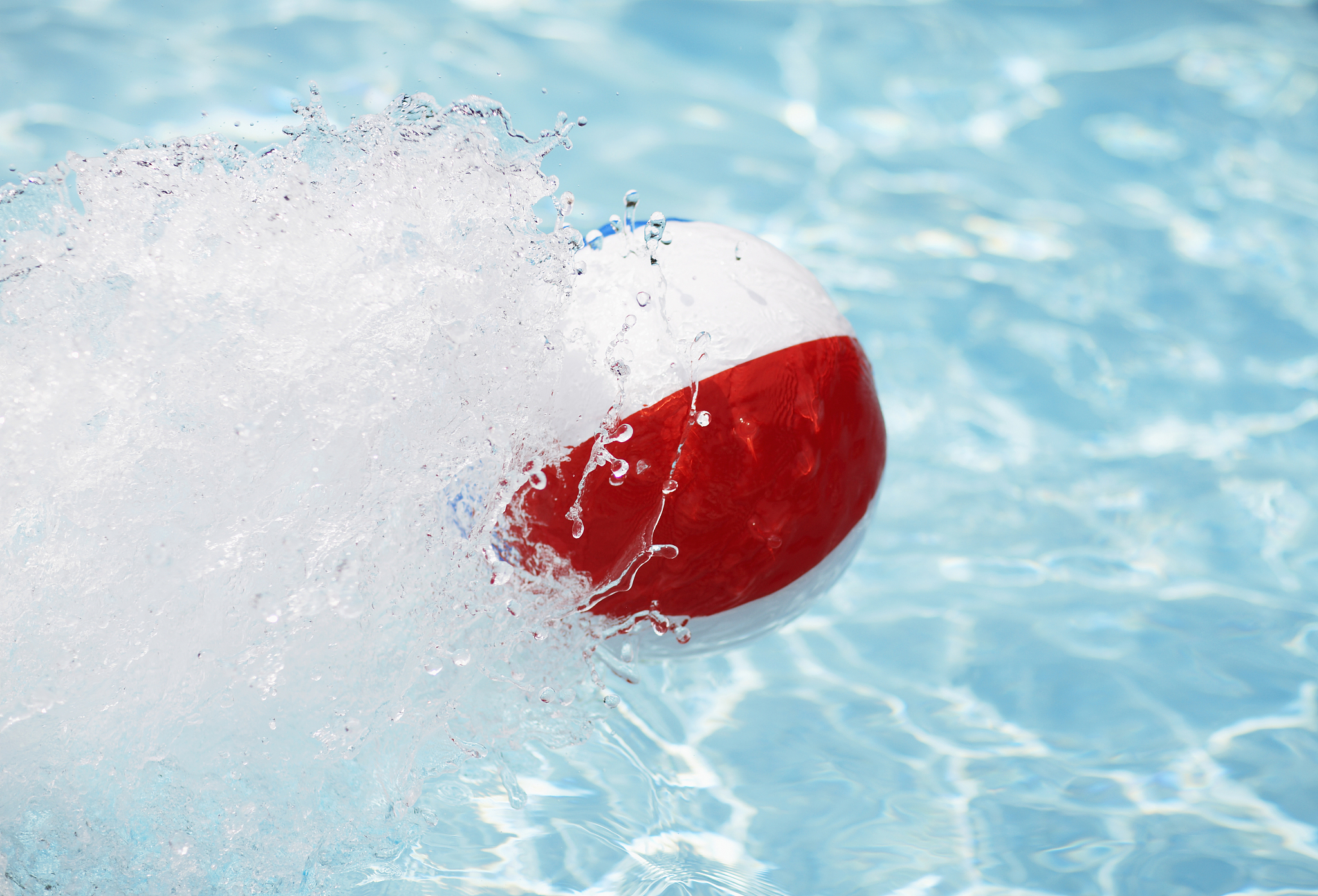 beach ball splashing water