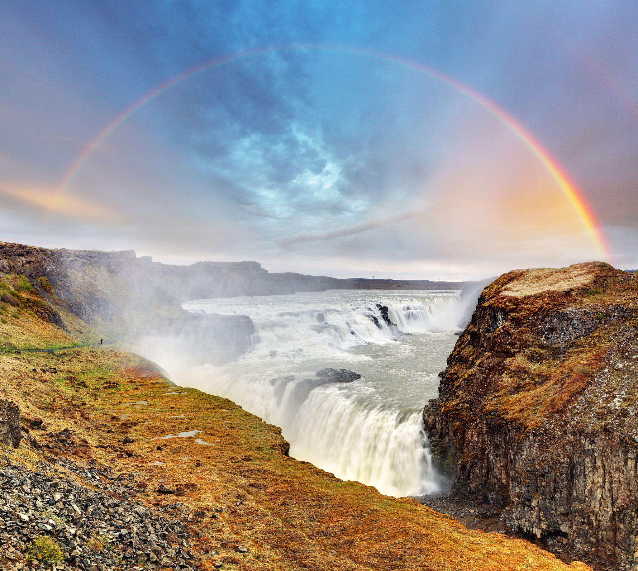 gullfoss waterfall , iceland on a sunny day with a rainbow