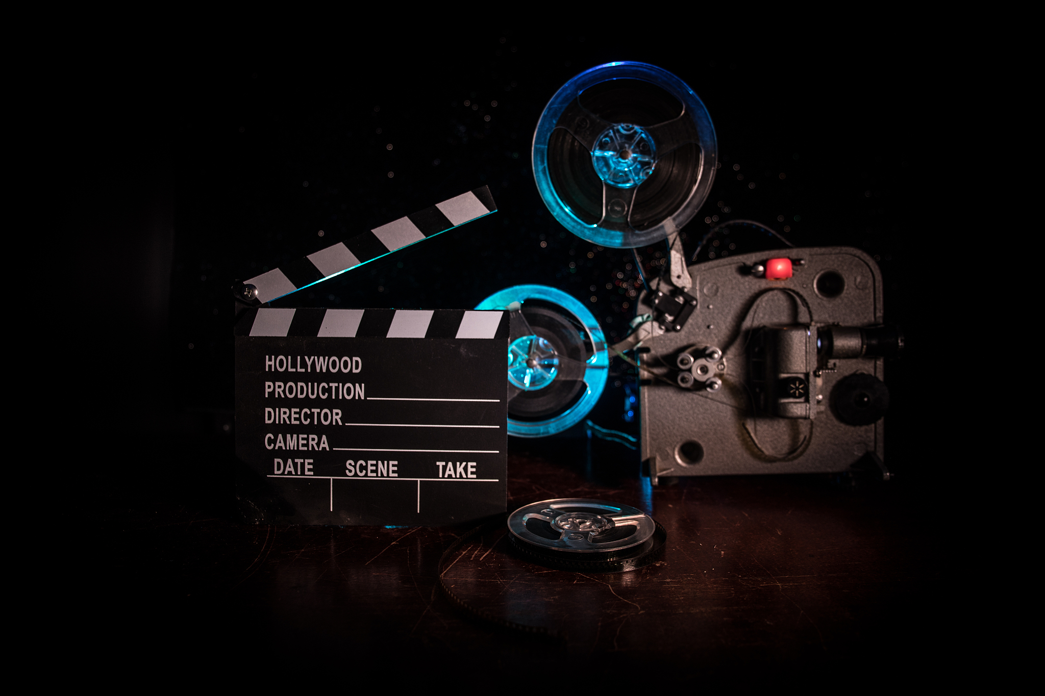 old vintage movie projector on a dark background with fog and li