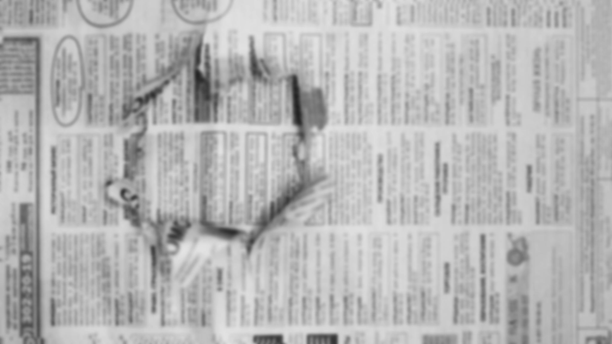newspapers with hole in page