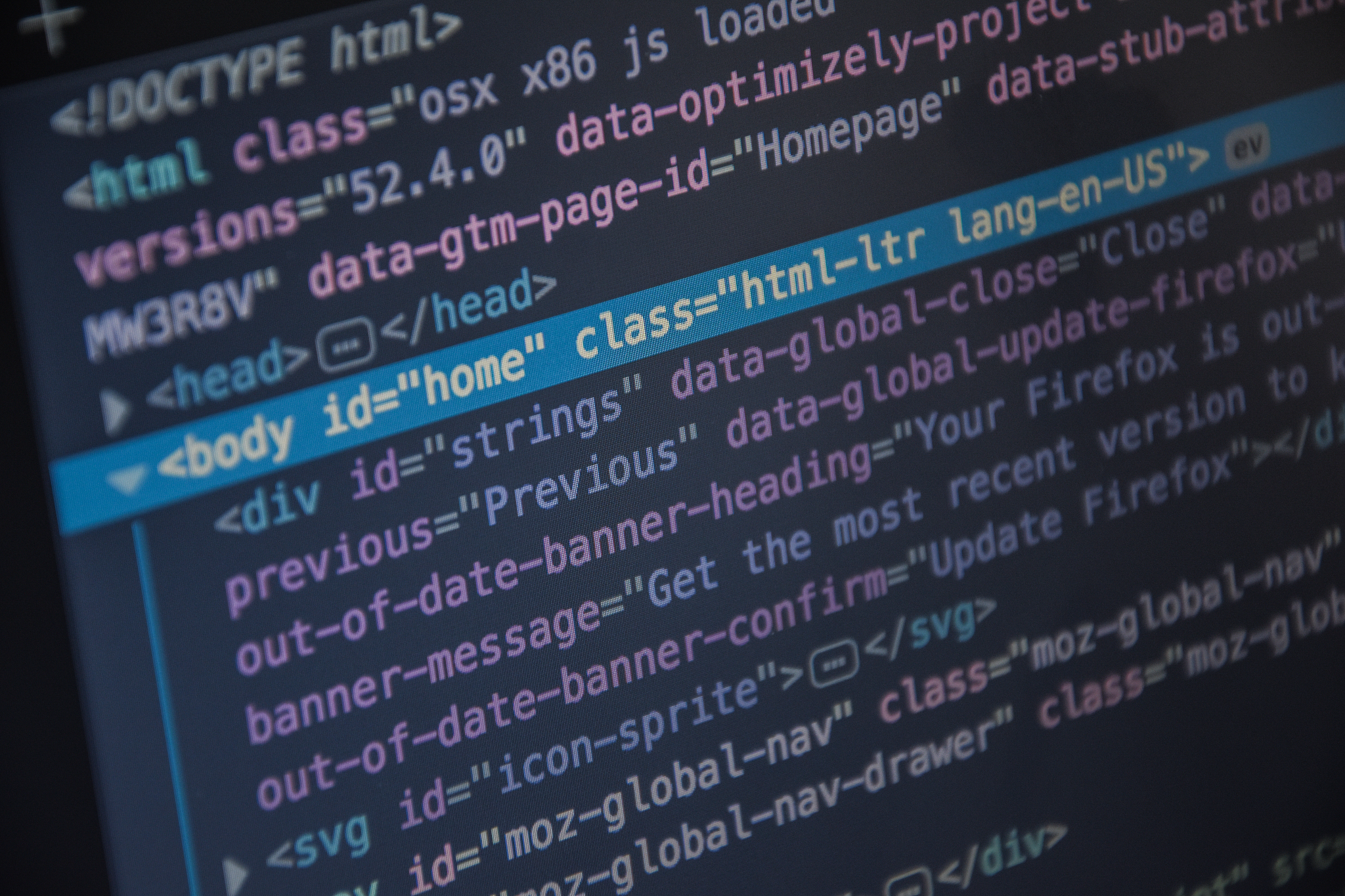 close up css html code on monitor screen with black background