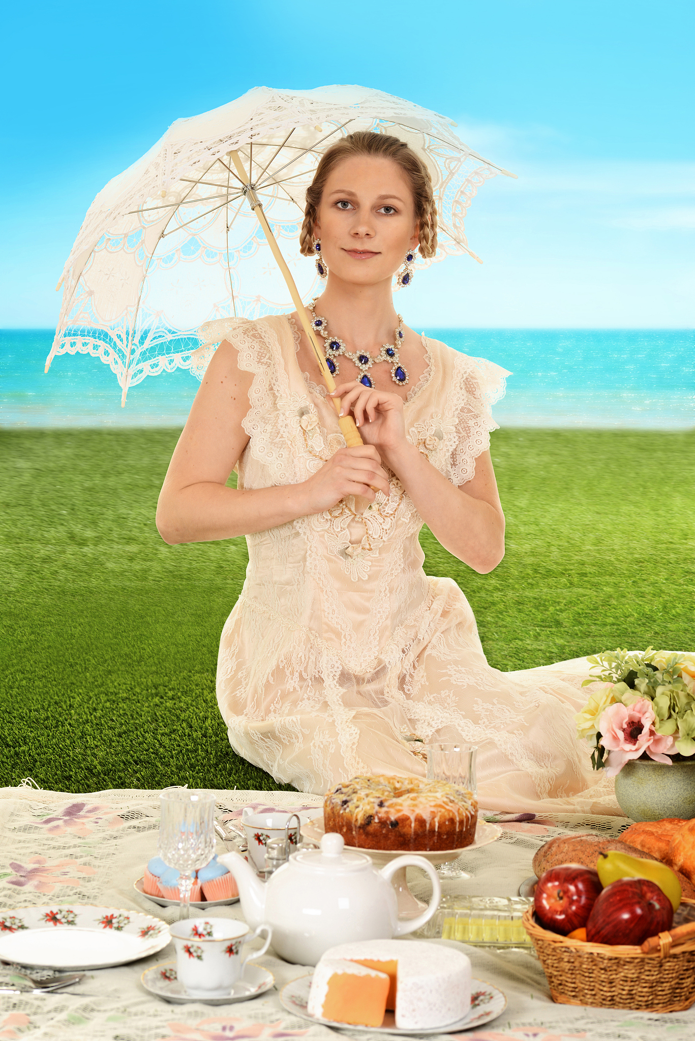 young edwardian woman at picnic with umbrella